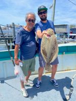 a person holding a fish