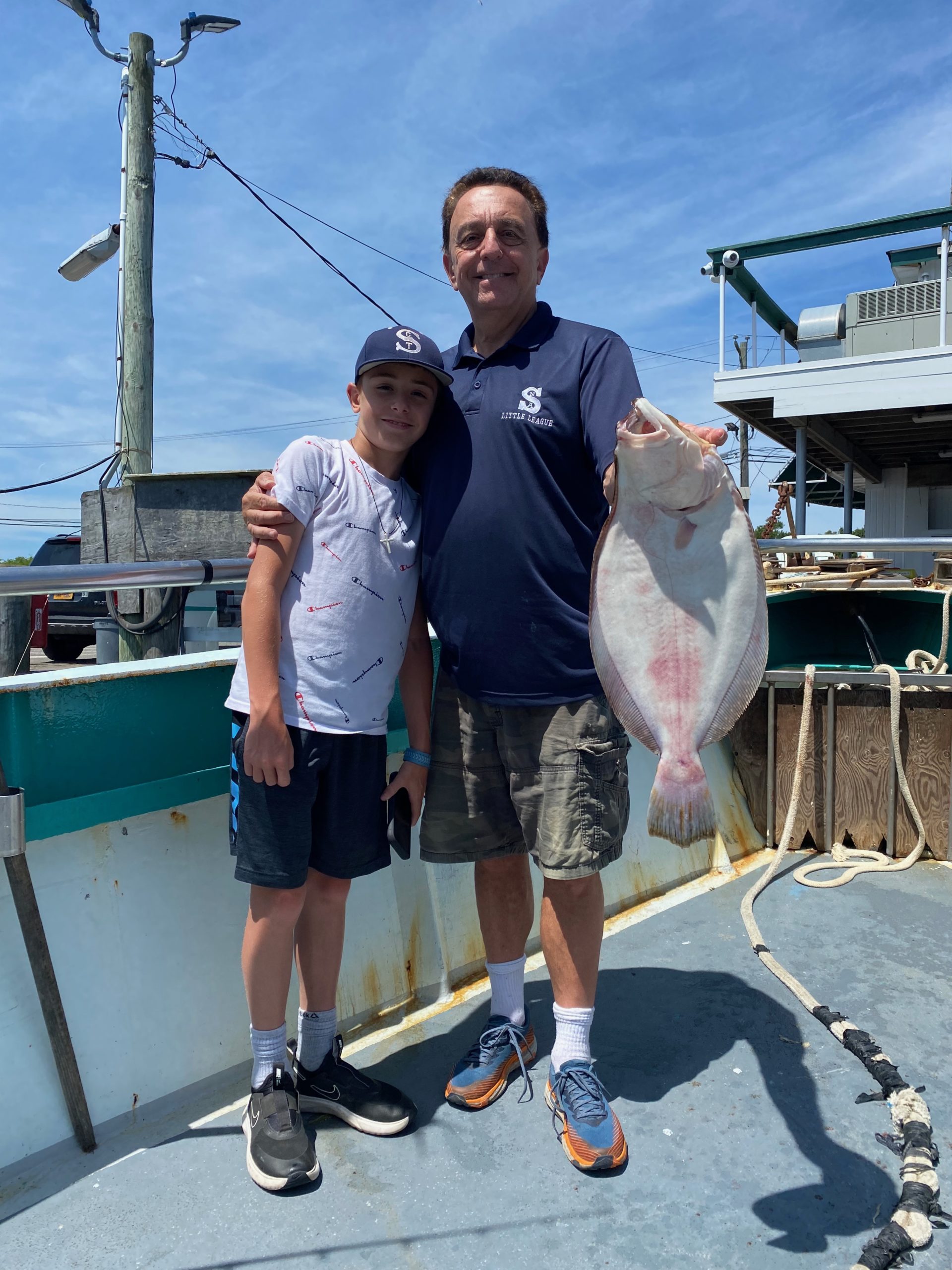 a man holding a fish