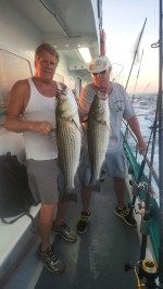a man holding a fish