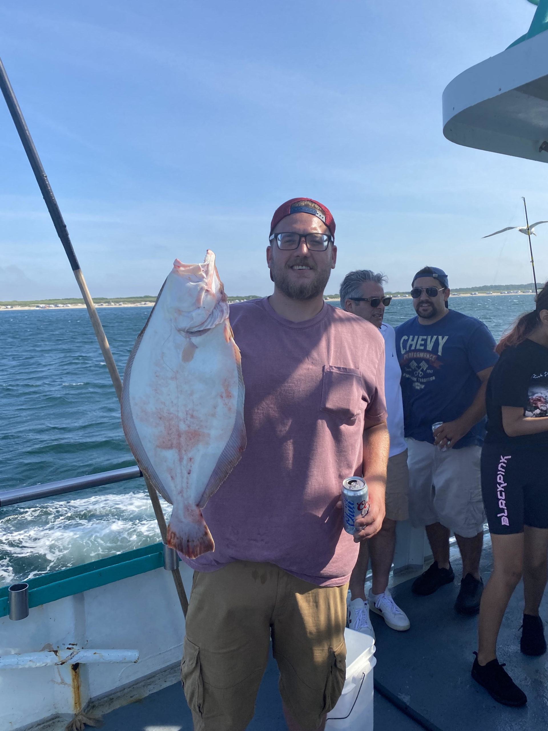 a man holding a fish in the water