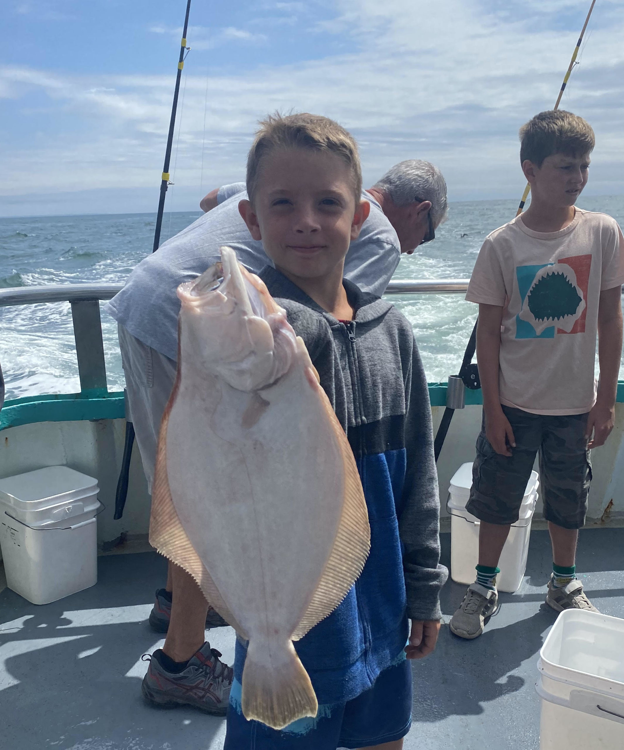 a couple of people that are standing in the water