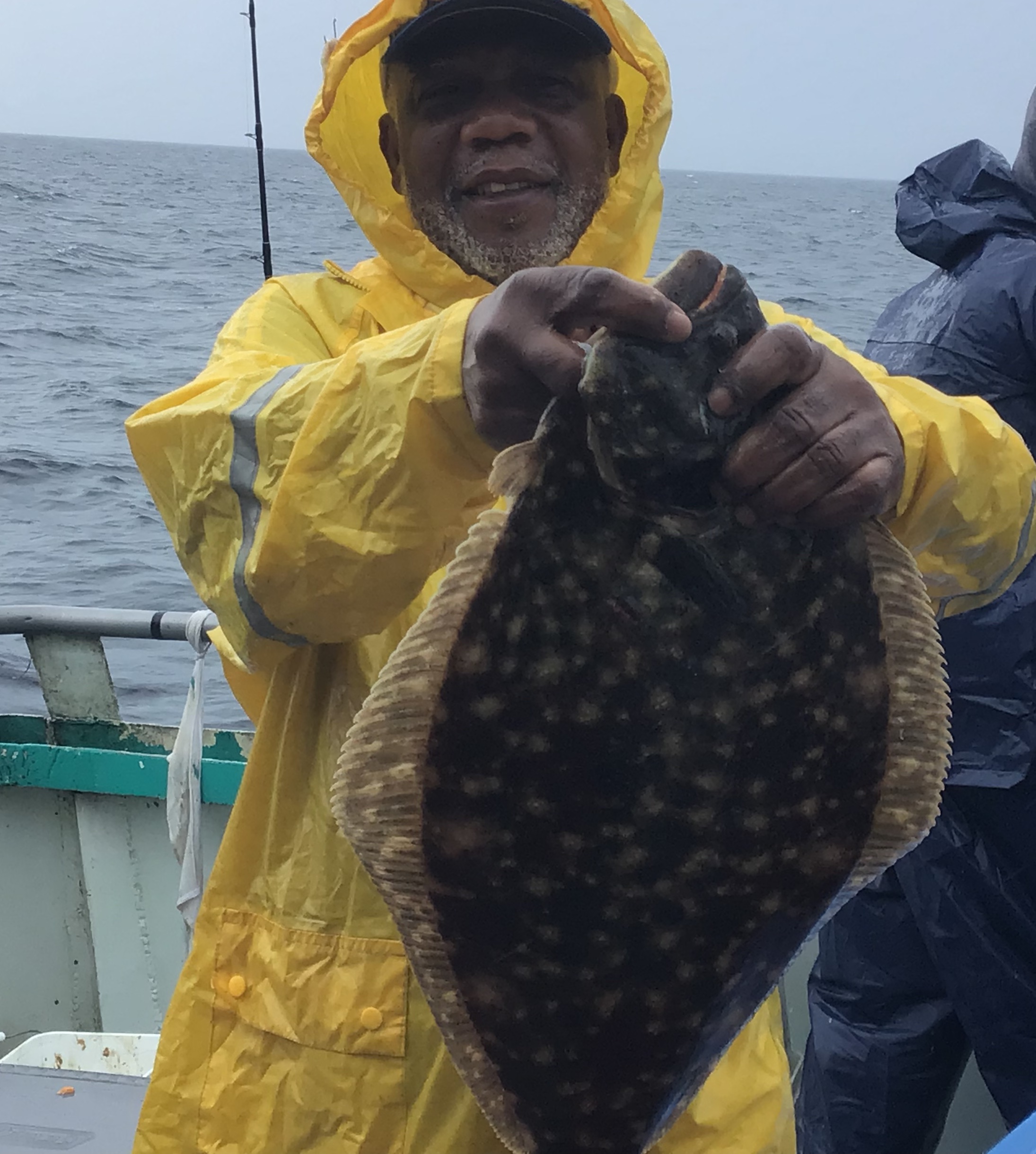 a statue of a man in a boat on the water