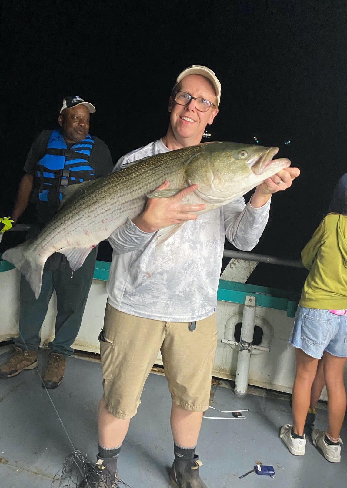 a person holding a fish