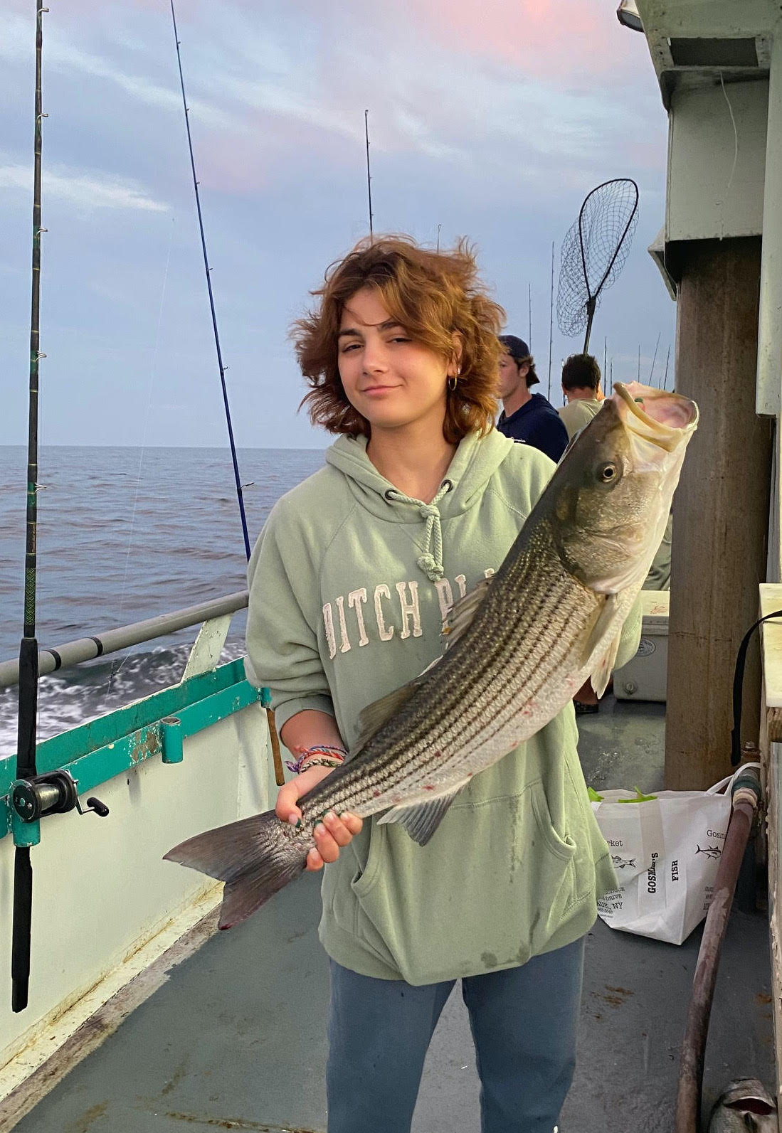a person holding a fish