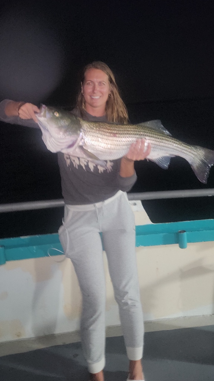 a person holding a fish