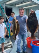 a man holding a fish