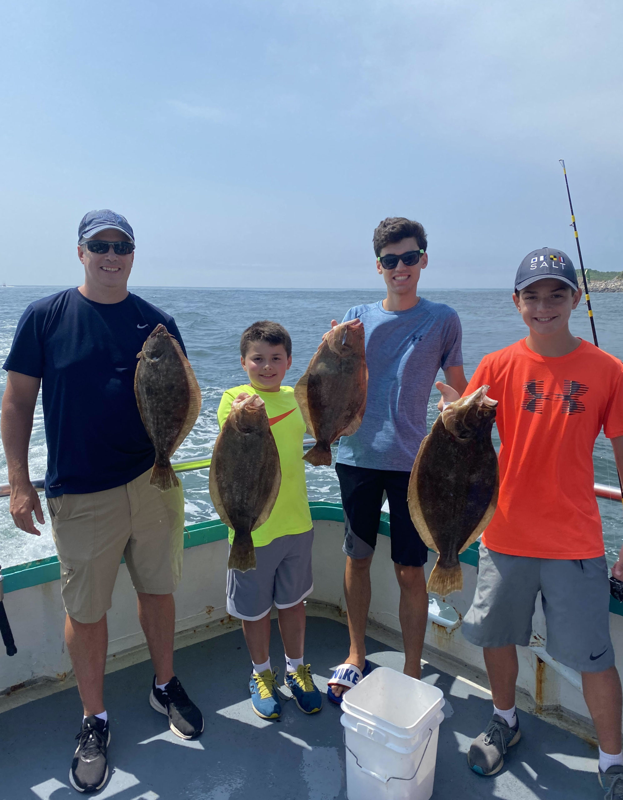 a group of people standing in a parking lot