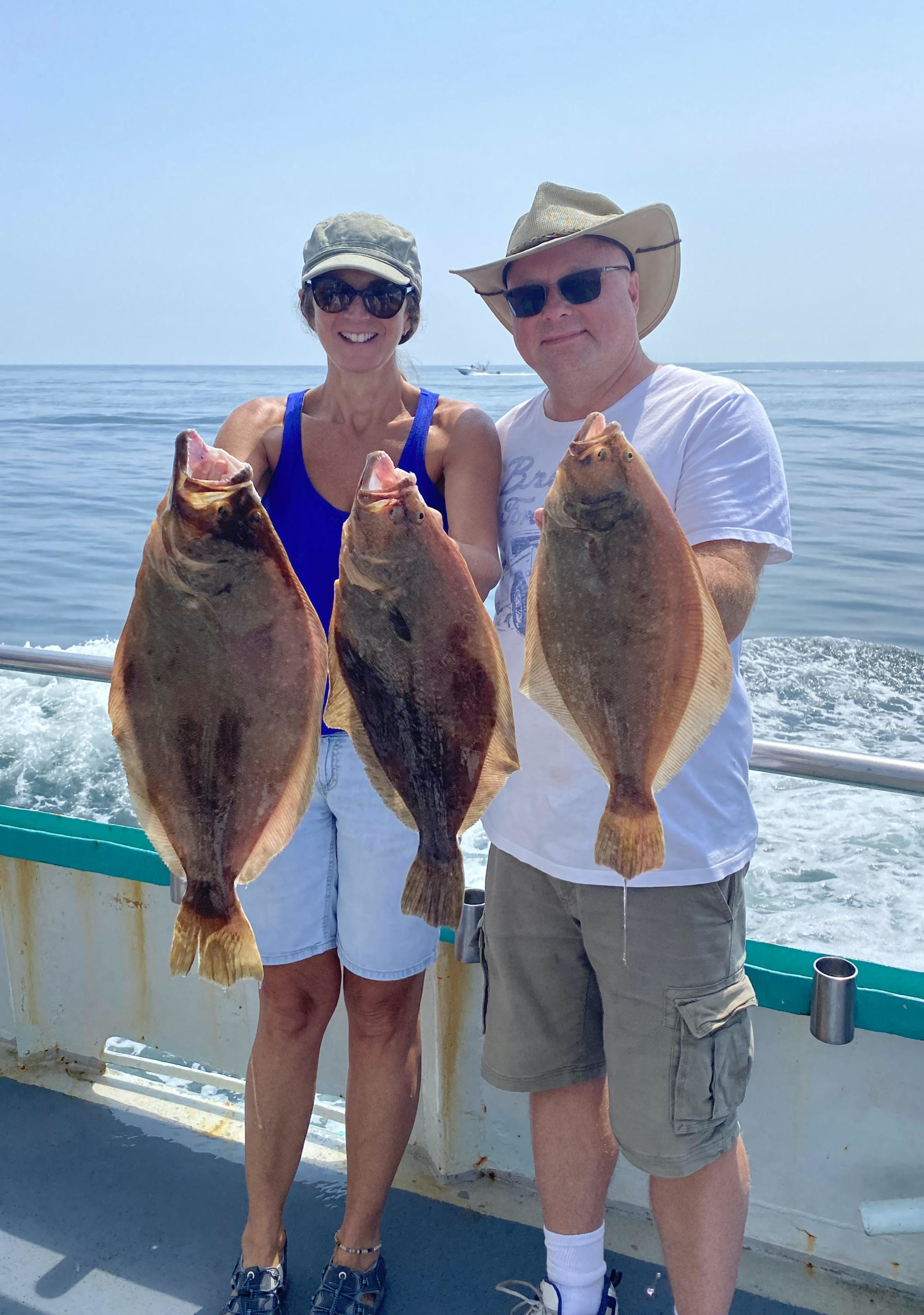 a person holding a fish in the water