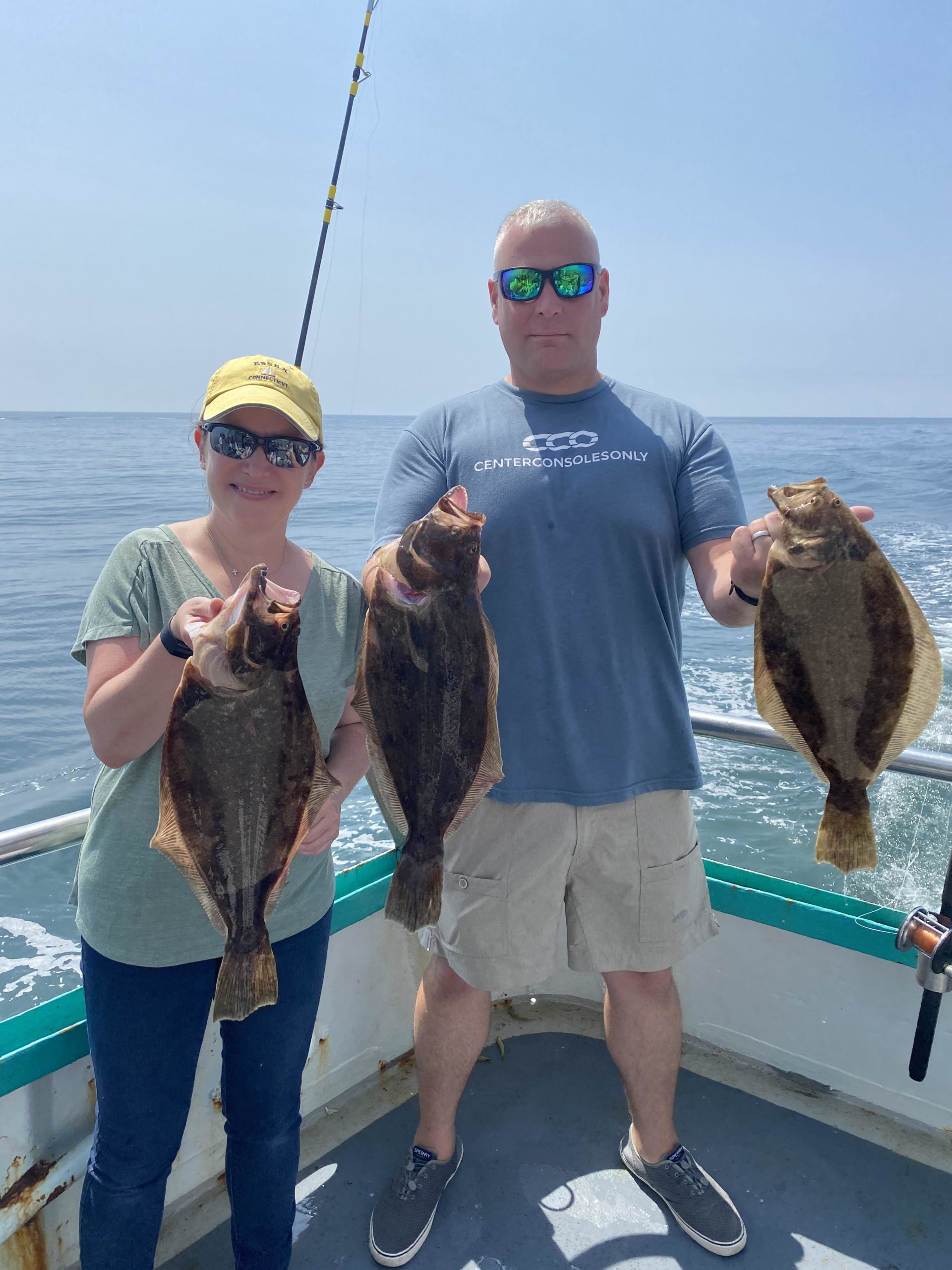 a person holding a fish in the water