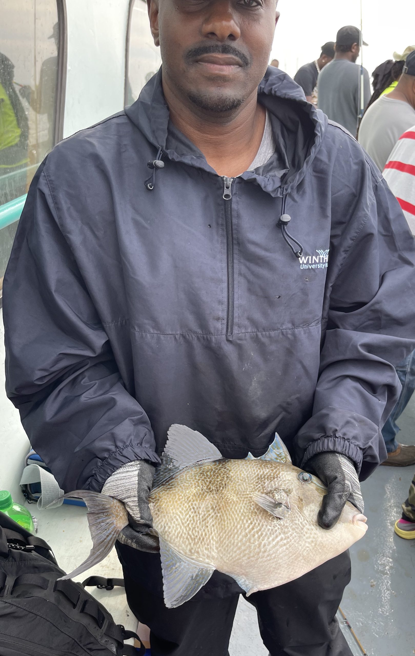 a man wearing a hat and glasses