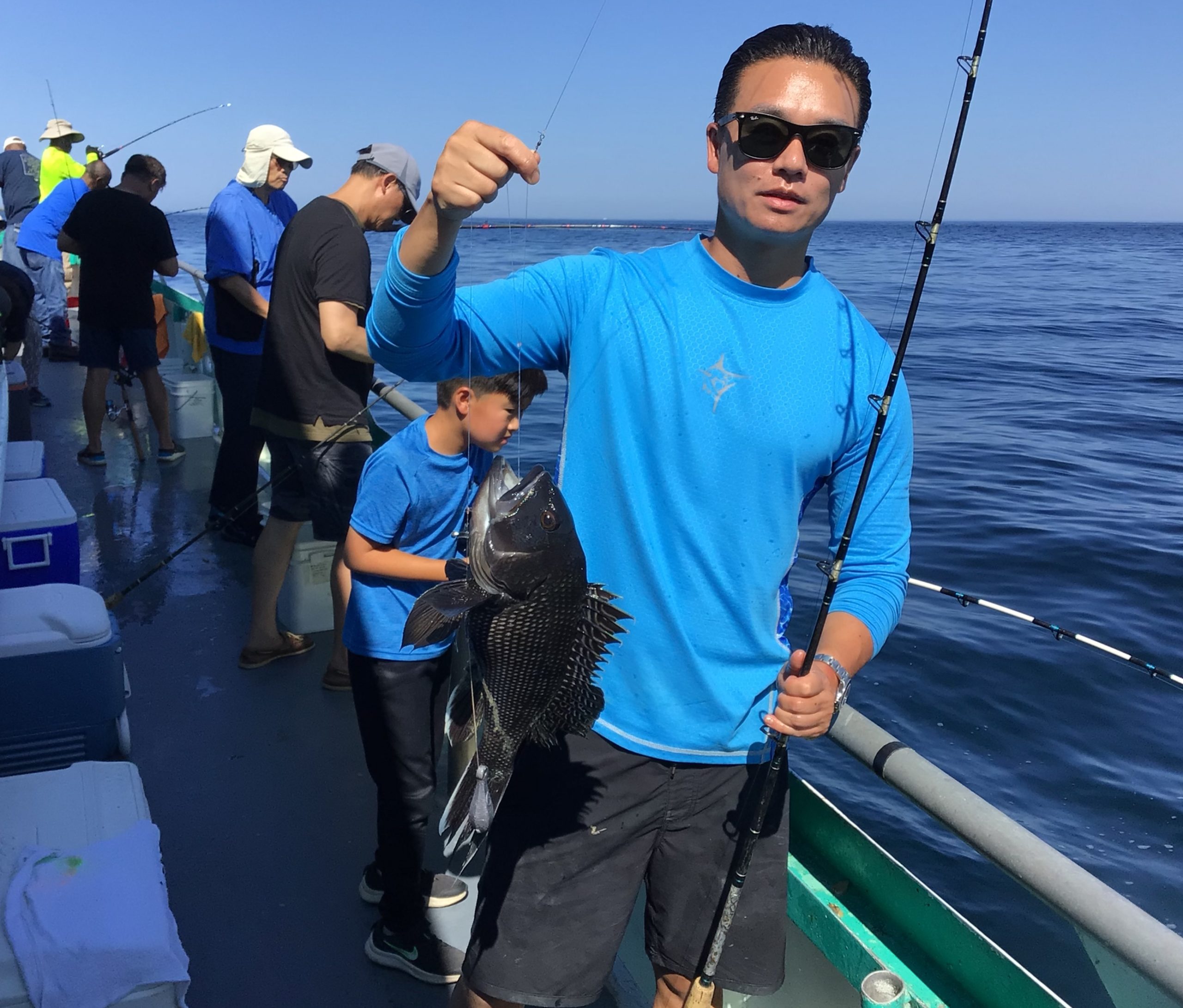 a man standing on a boat in the water