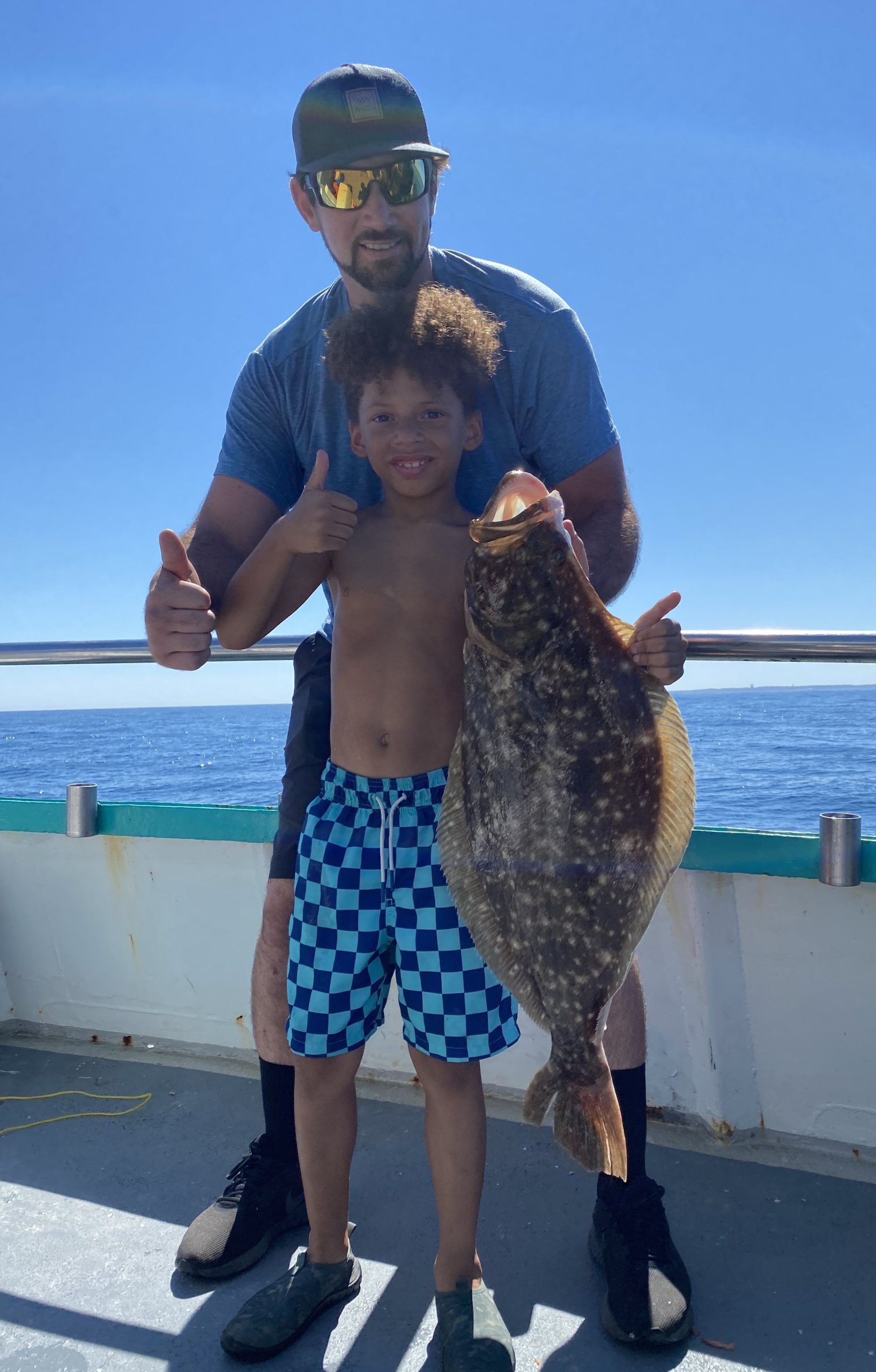 a man standing in front of water