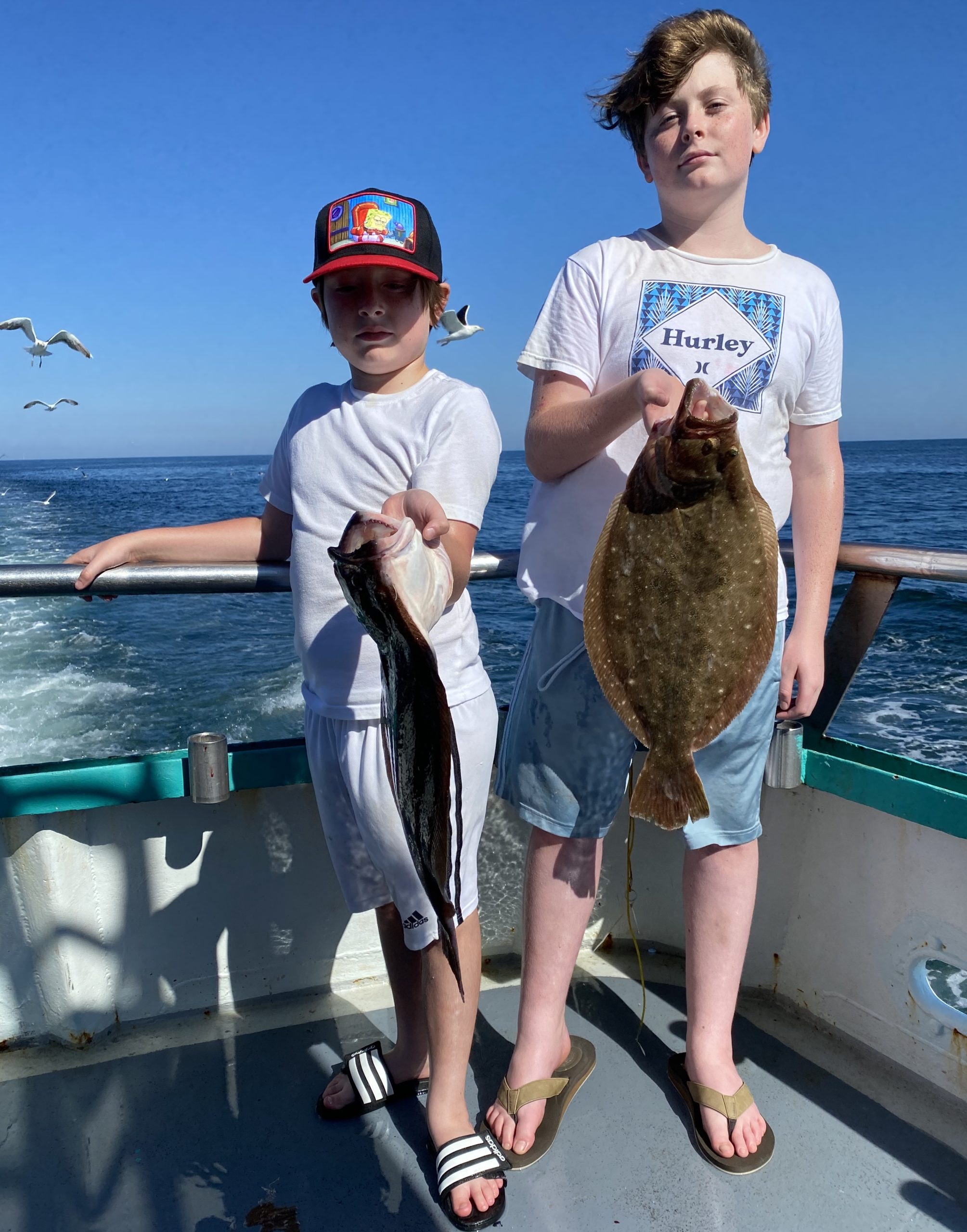 a person holding a fish in the water