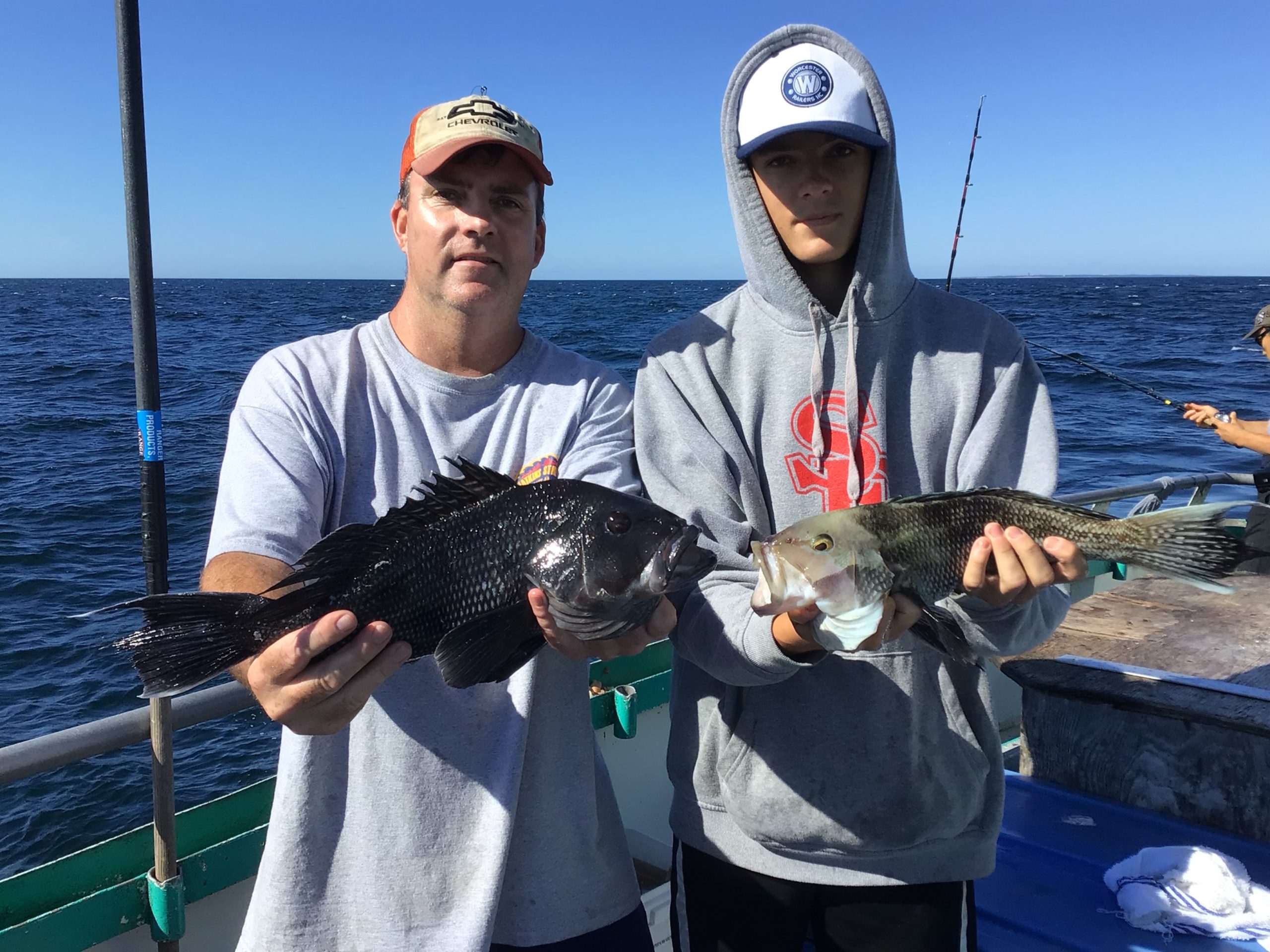 a person holding a fish in the water
