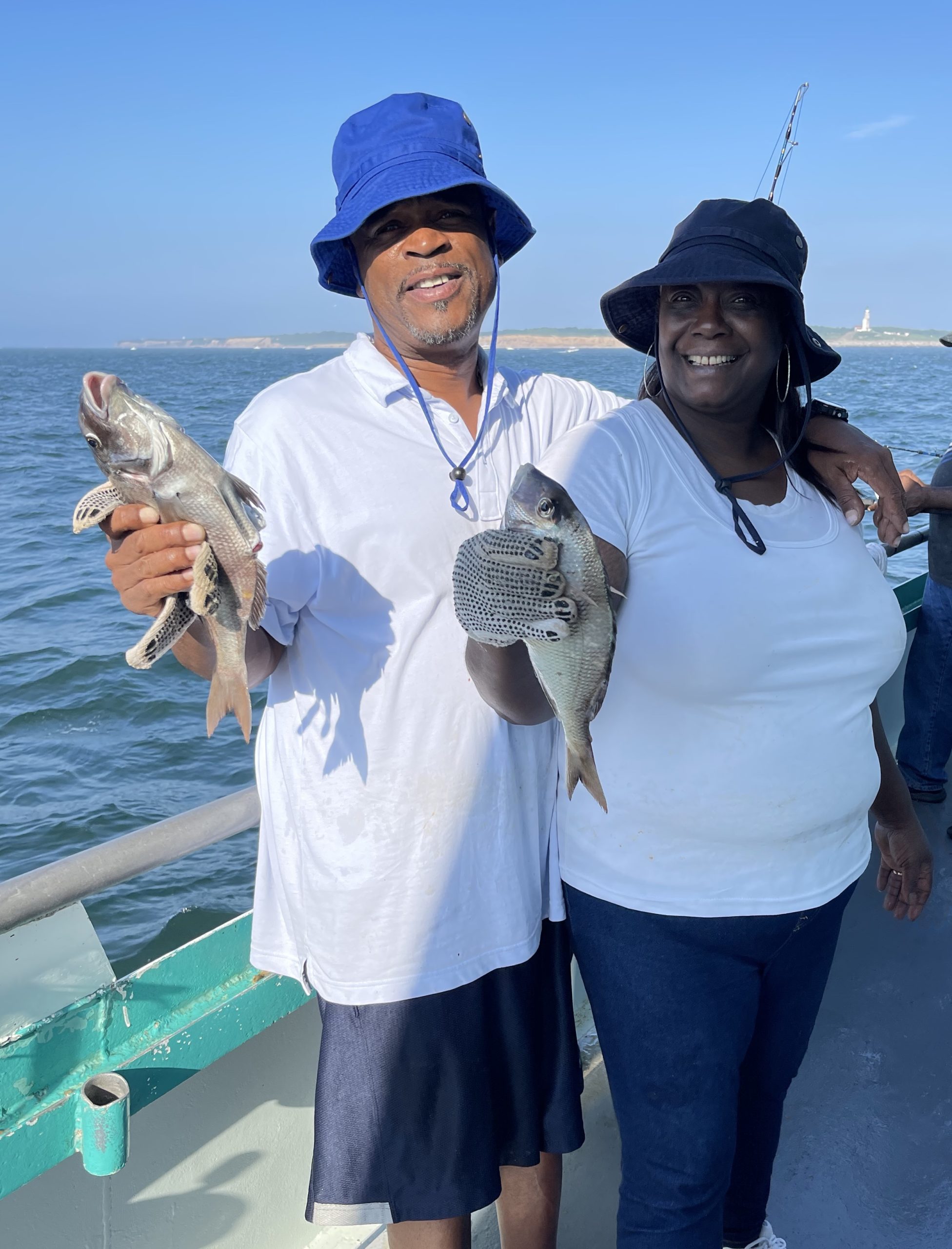 a couple of people that are standing in the water