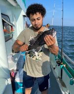 a man holding a fish