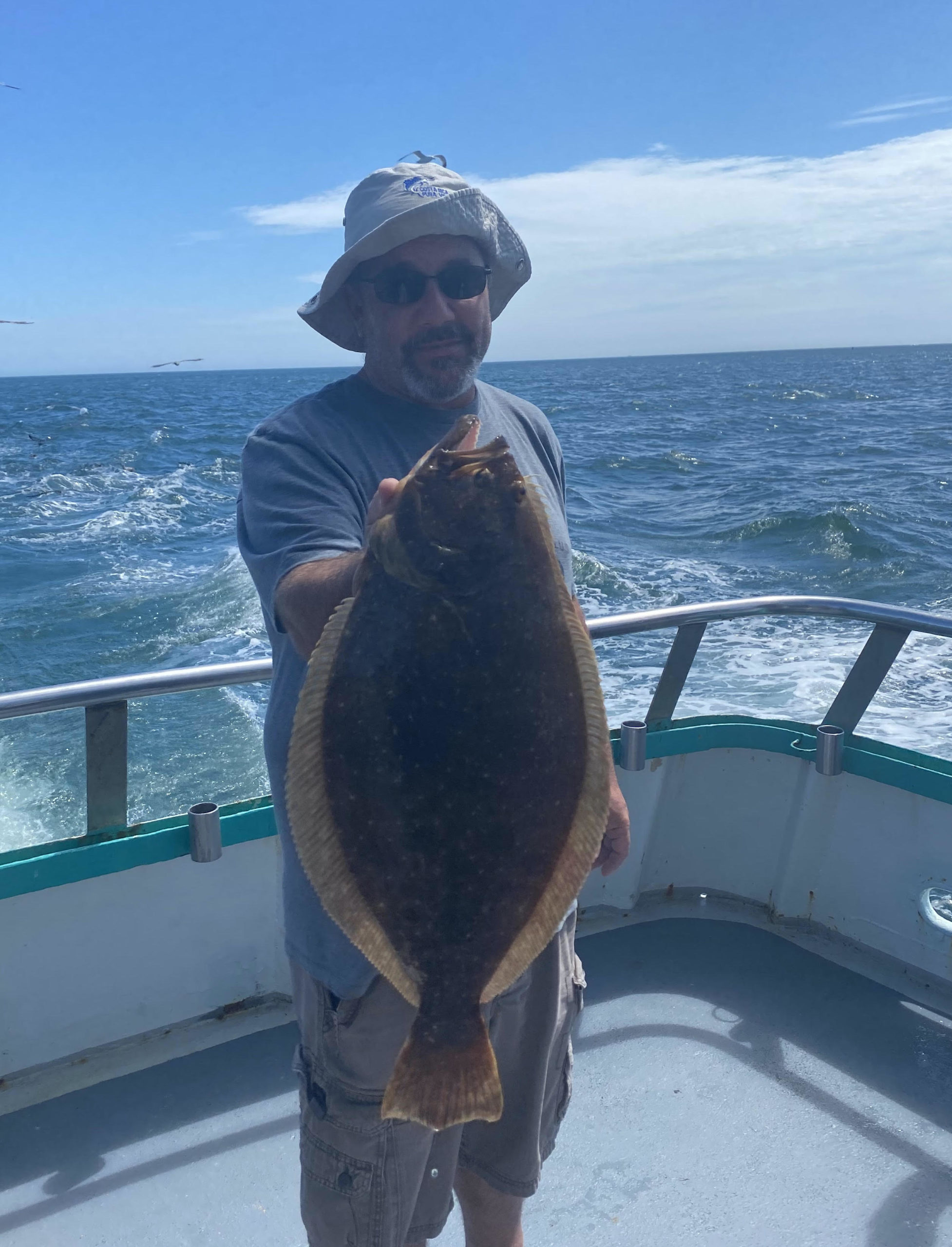 a person holding a fish in the water