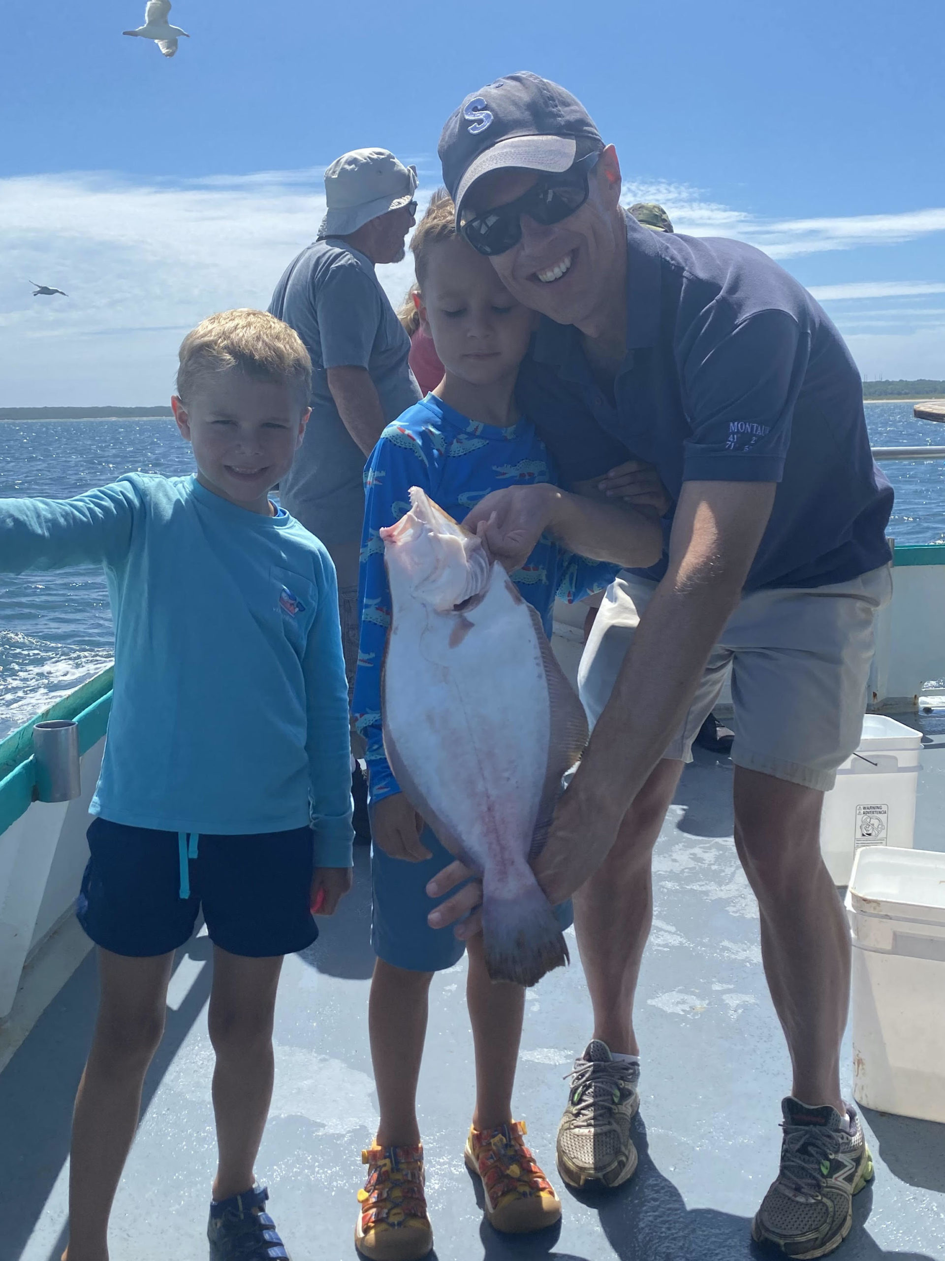 a person holding a fish in the water