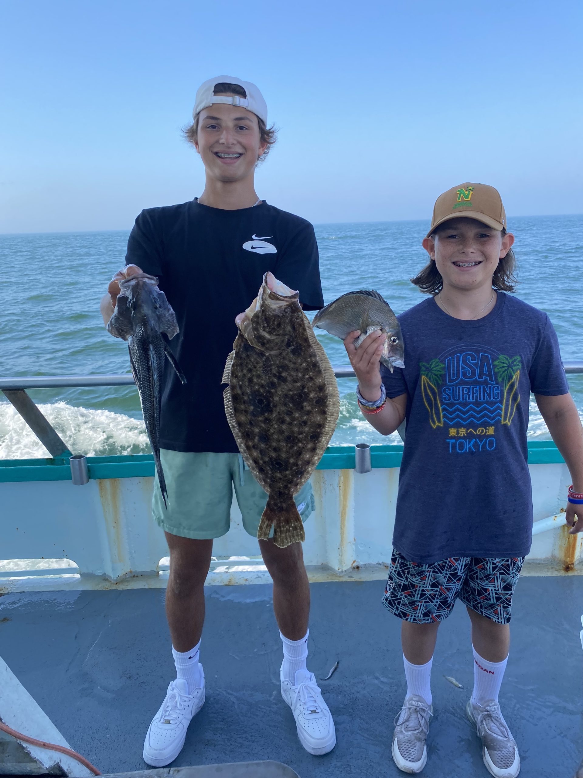 a person holding a fish in the water