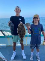 a person holding a fish in the water