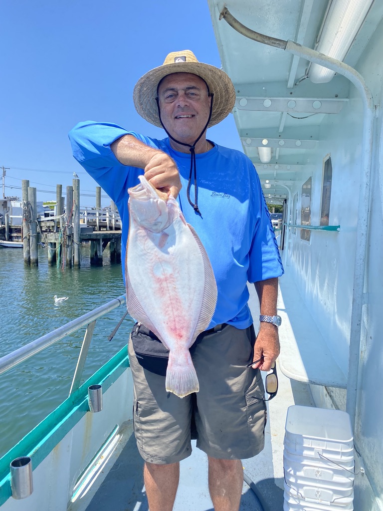a man holding a fish