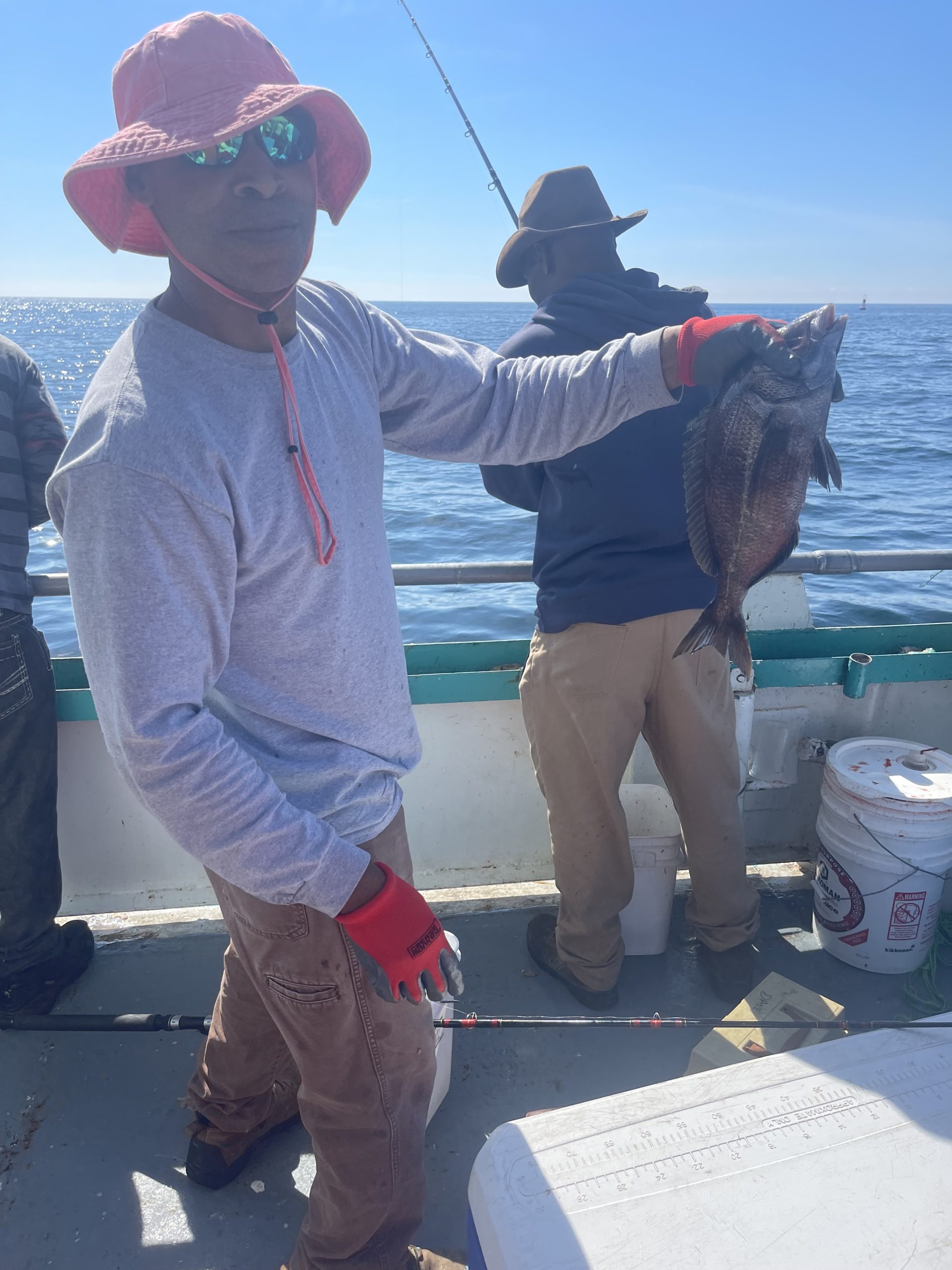 a person holding a fish in the water