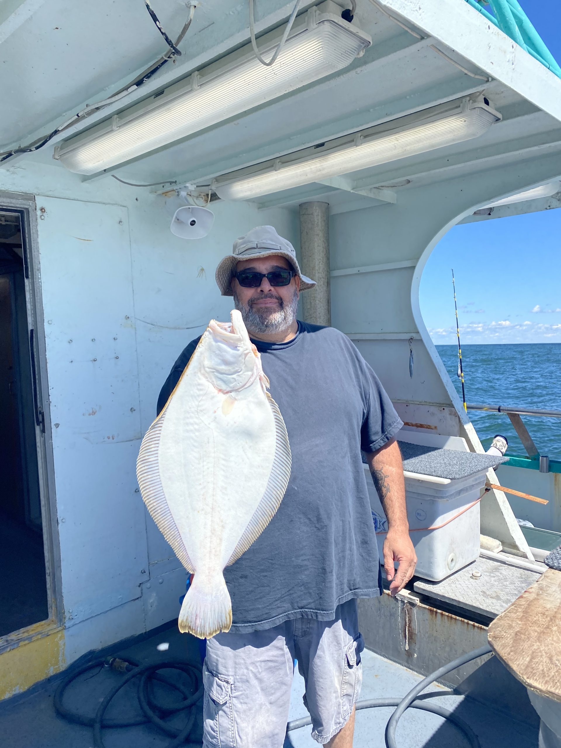 a man standing in front of a boat