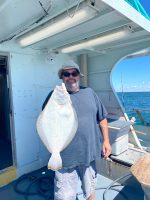a man standing in front of a boat