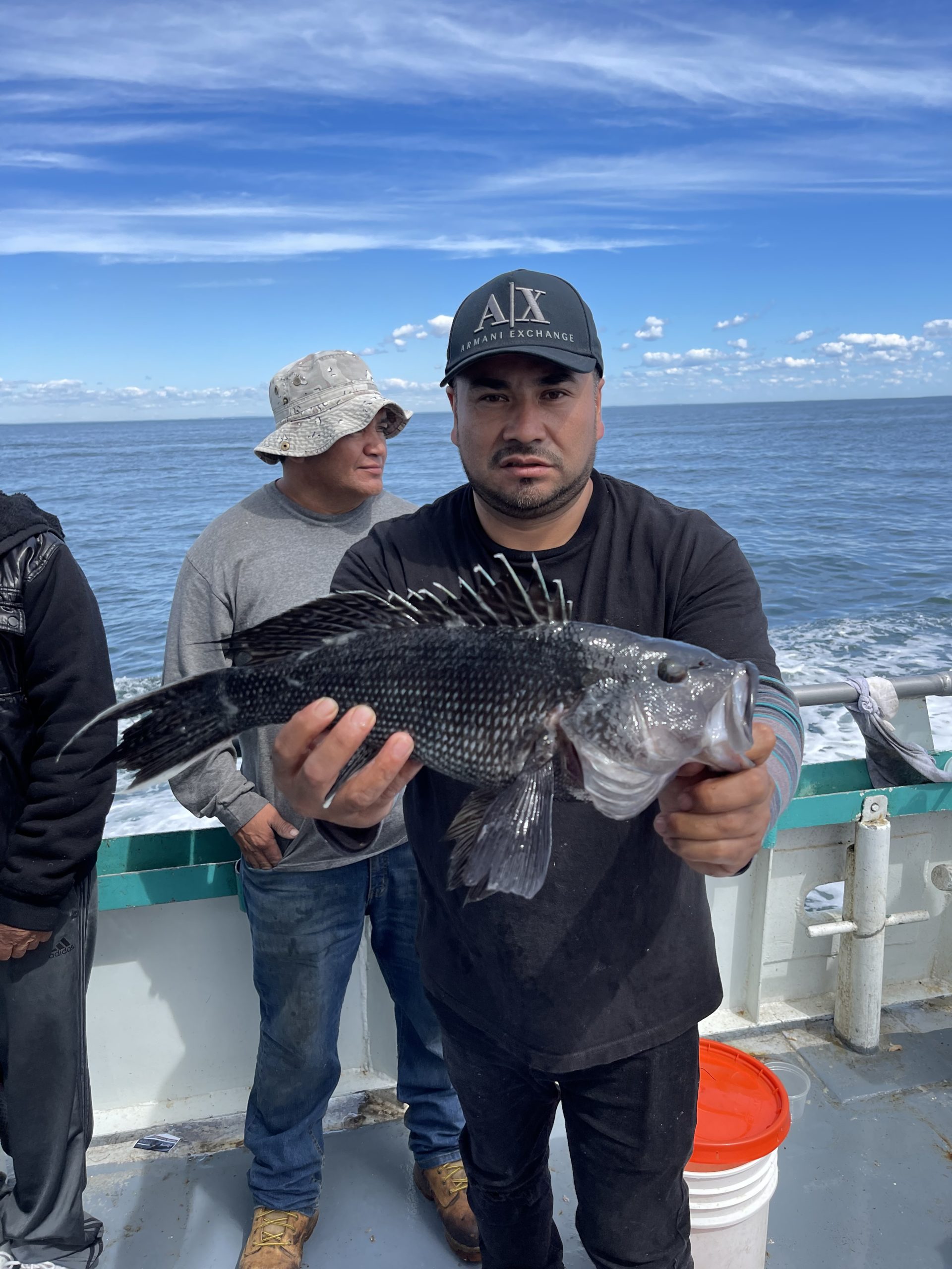 a person holding a fish in the water