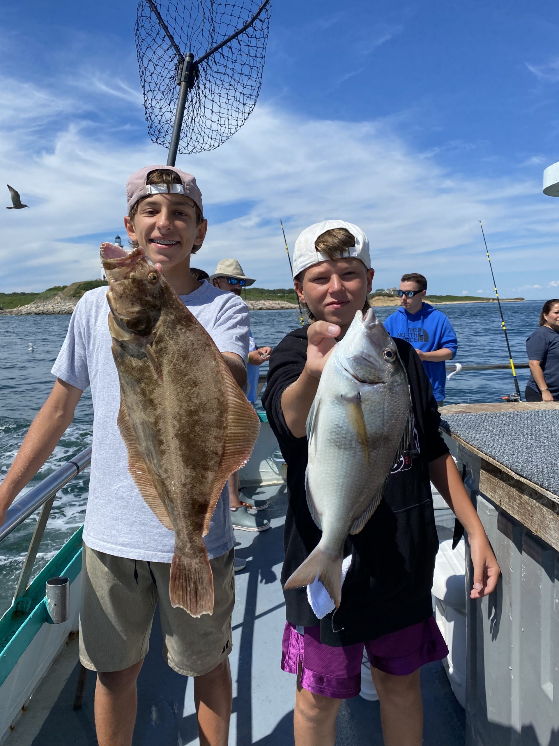 a person holding a fish in the water