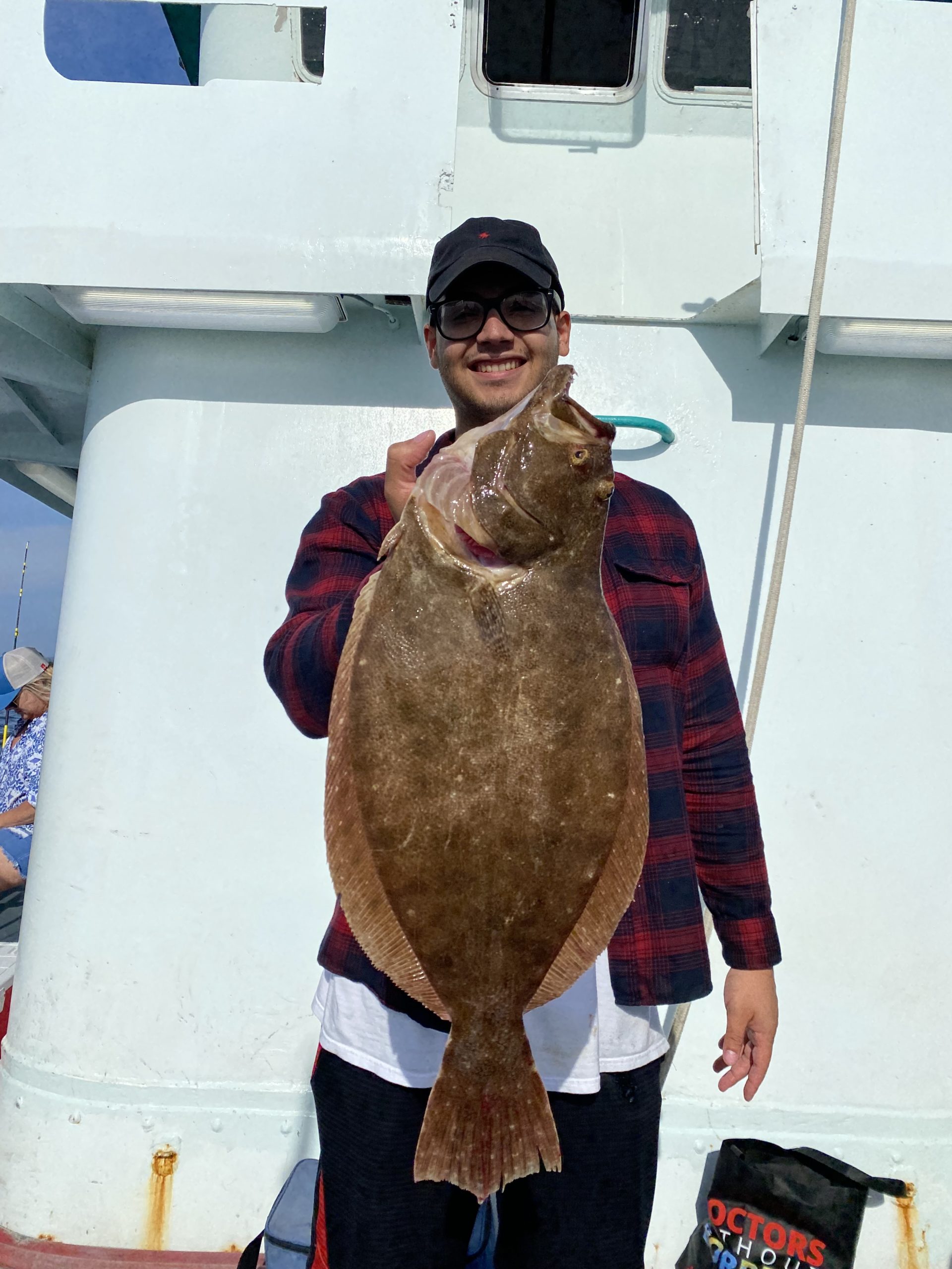 a man holding a fish