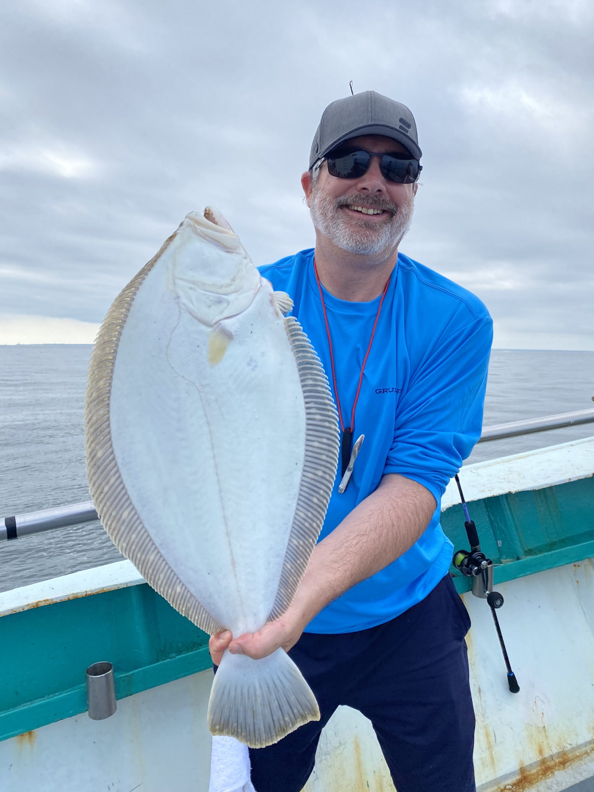 a man holding a fish