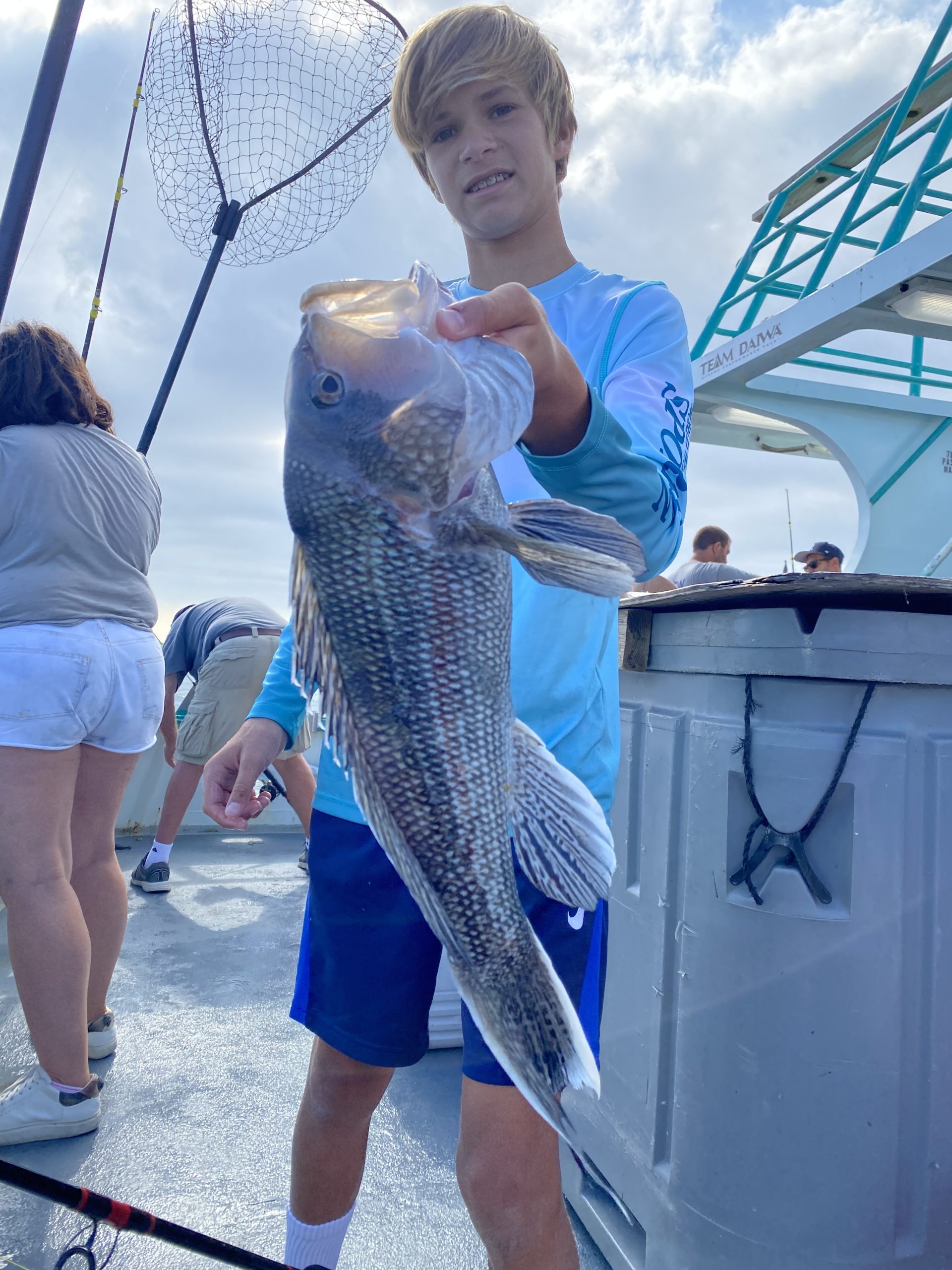 a person holding a fish in the water