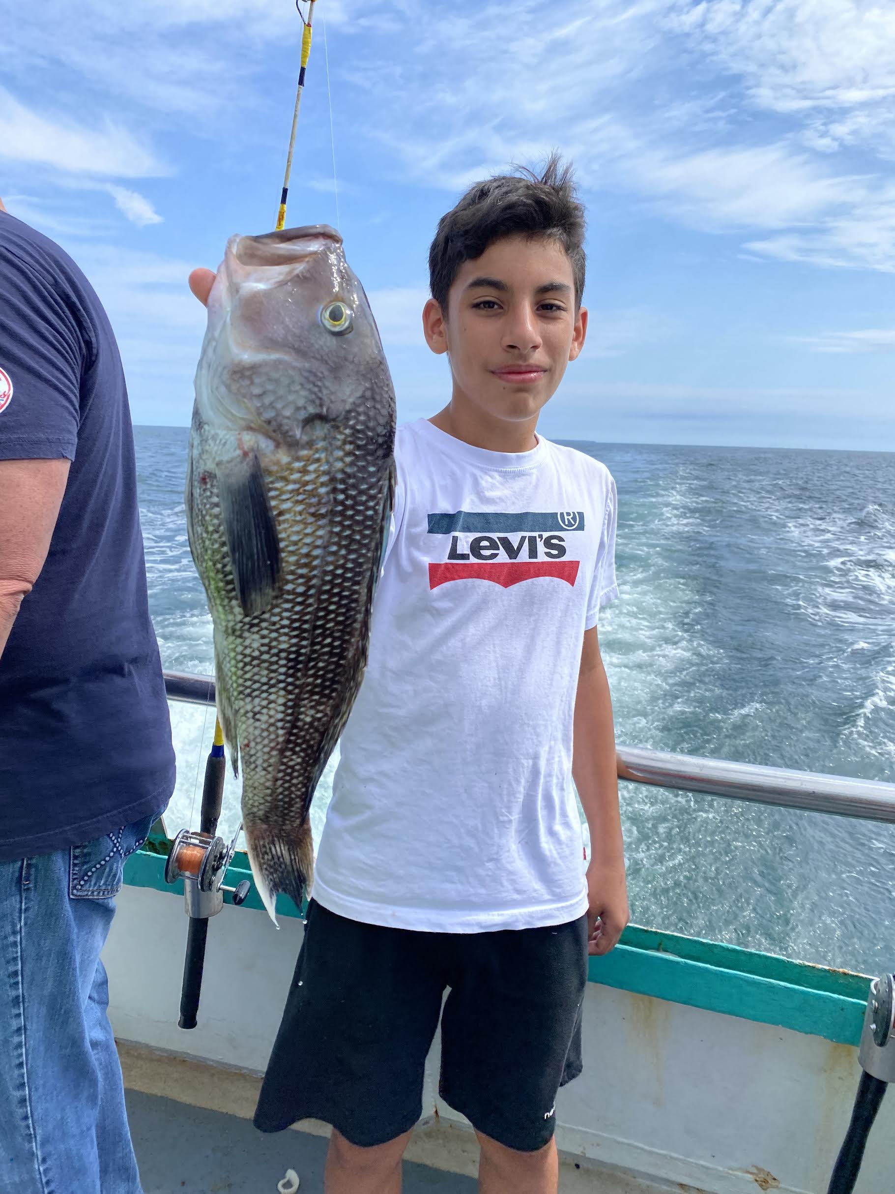 a person holding a fish