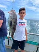 a person holding a fish