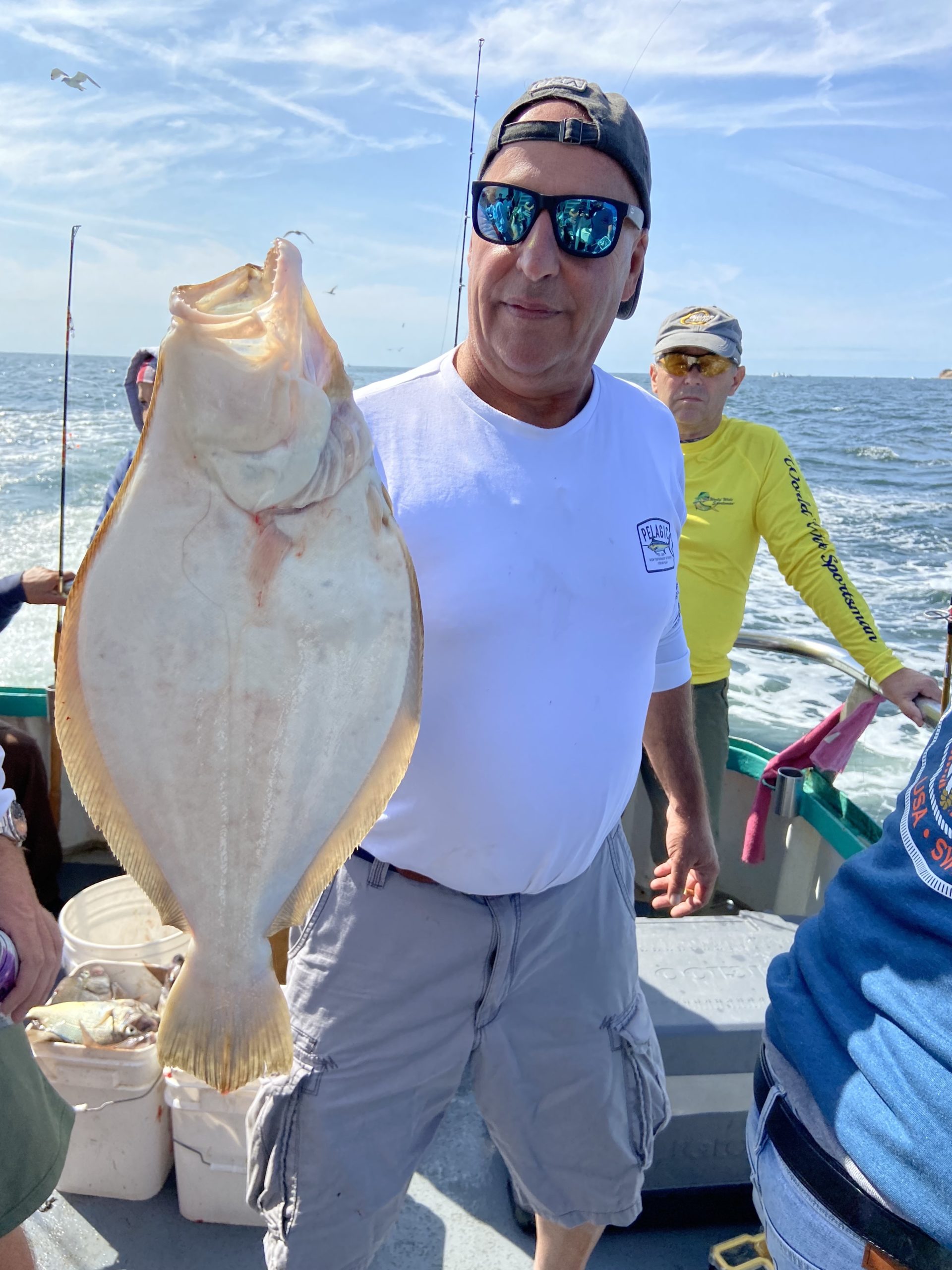 a person holding a fish in the water