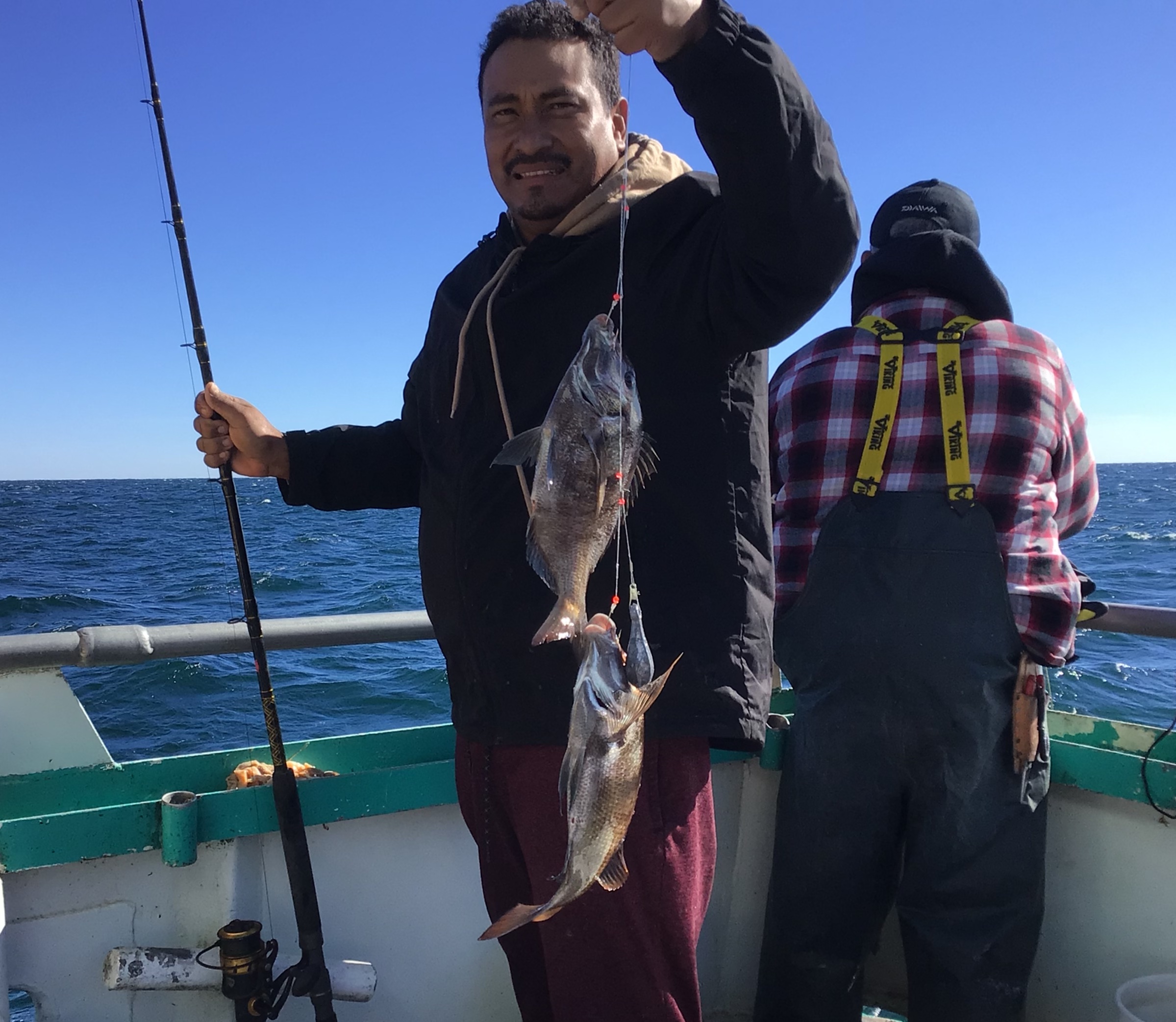 a man standing on a boat in the water