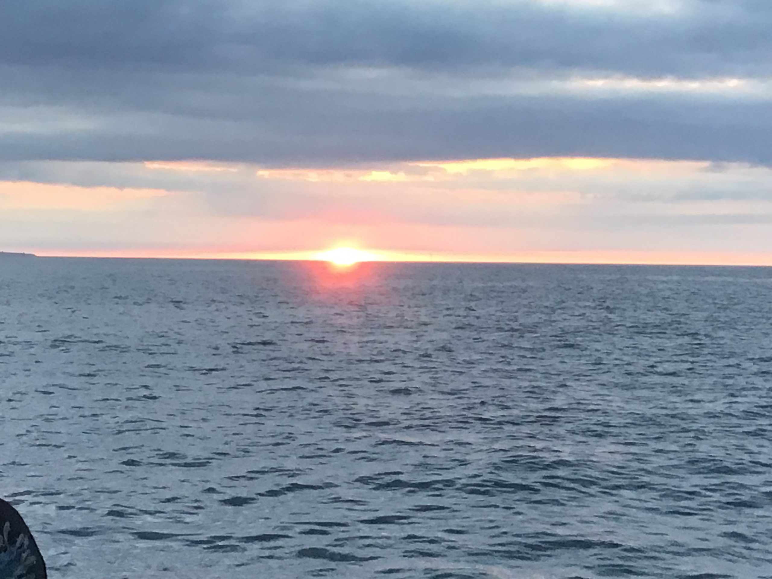 a sunset over a body of water