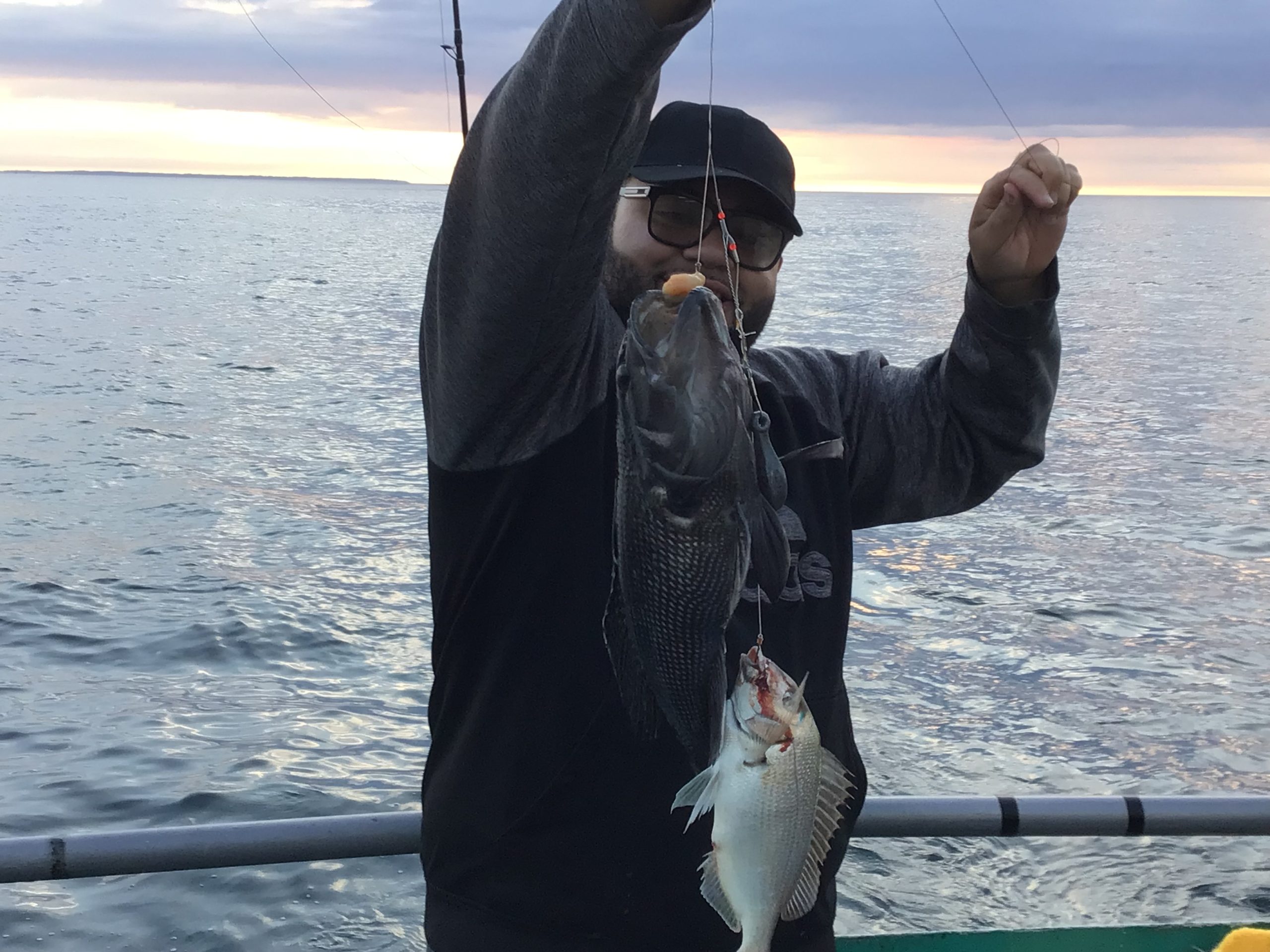 a person holding a fish in the water