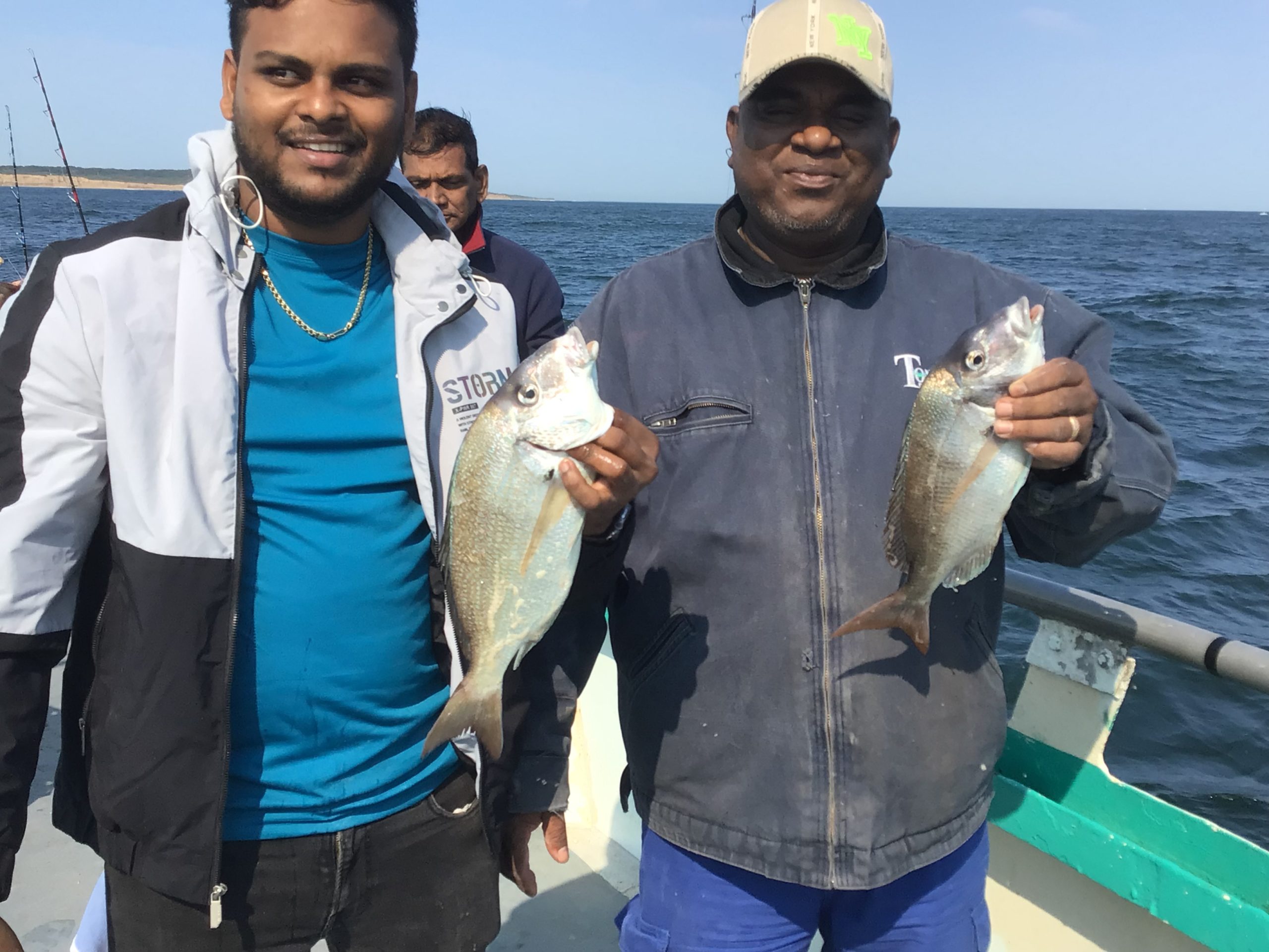 a person holding a fish in the water