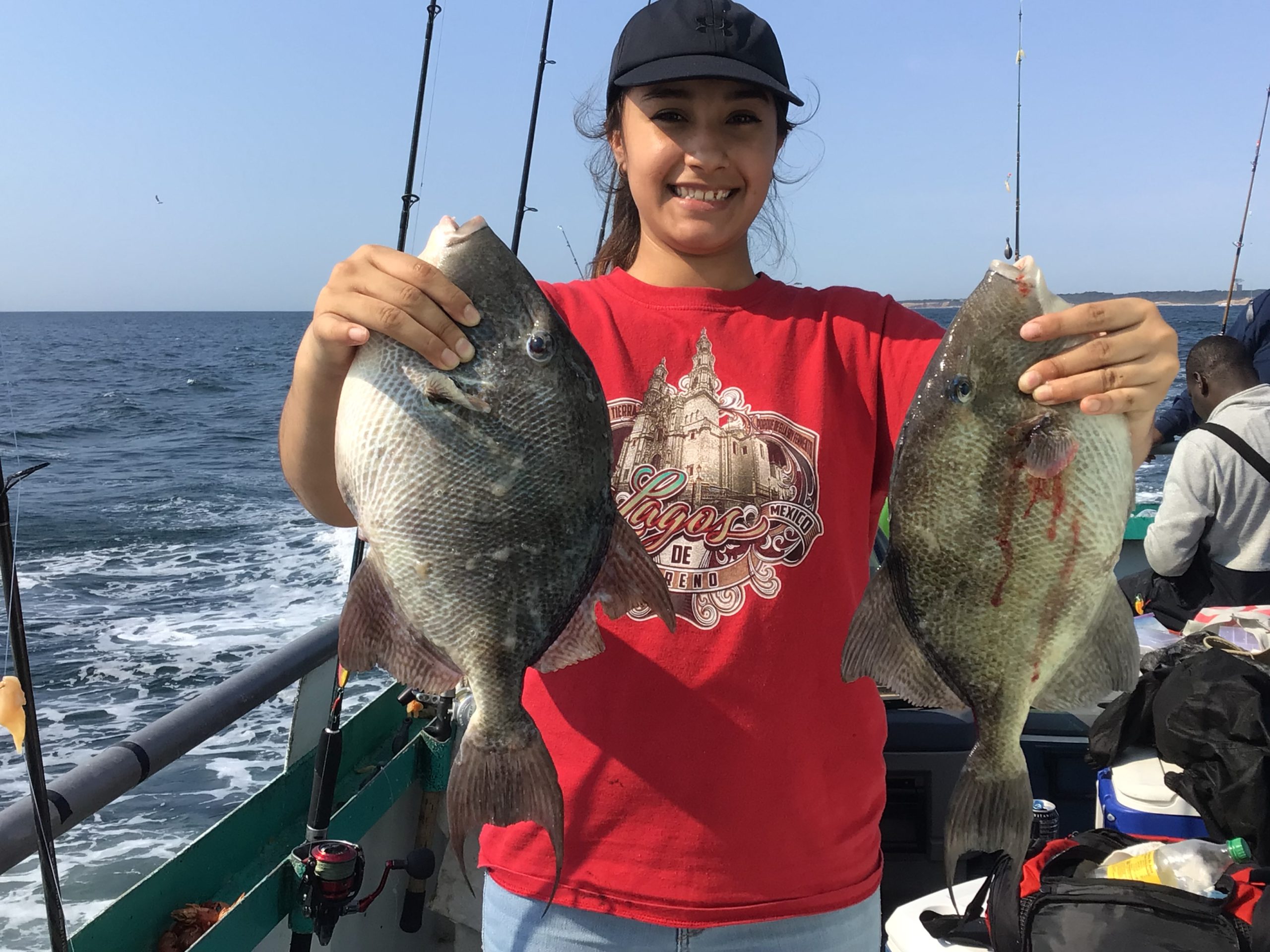 a person holding a fish