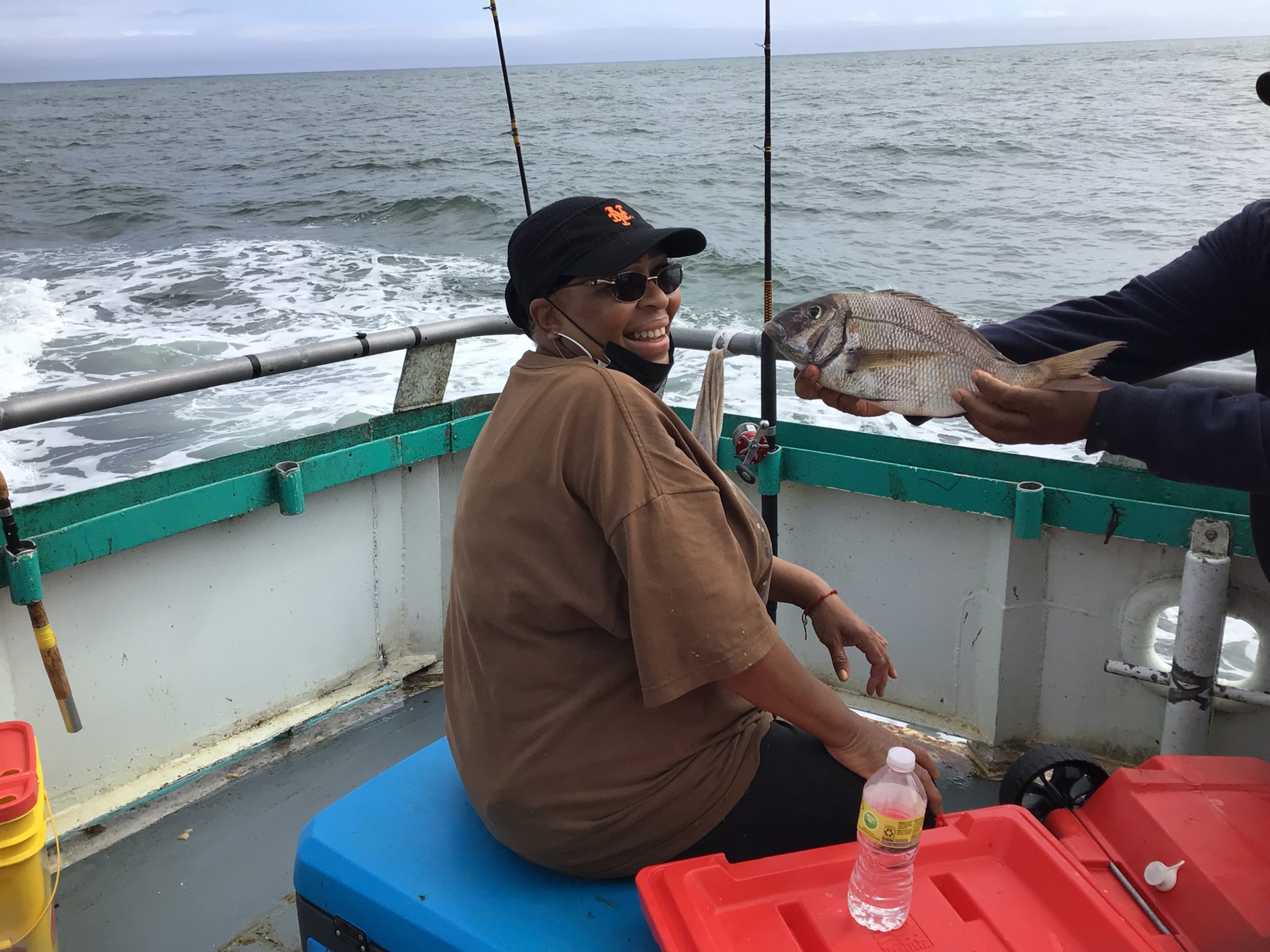 a person standing on a boat in the water