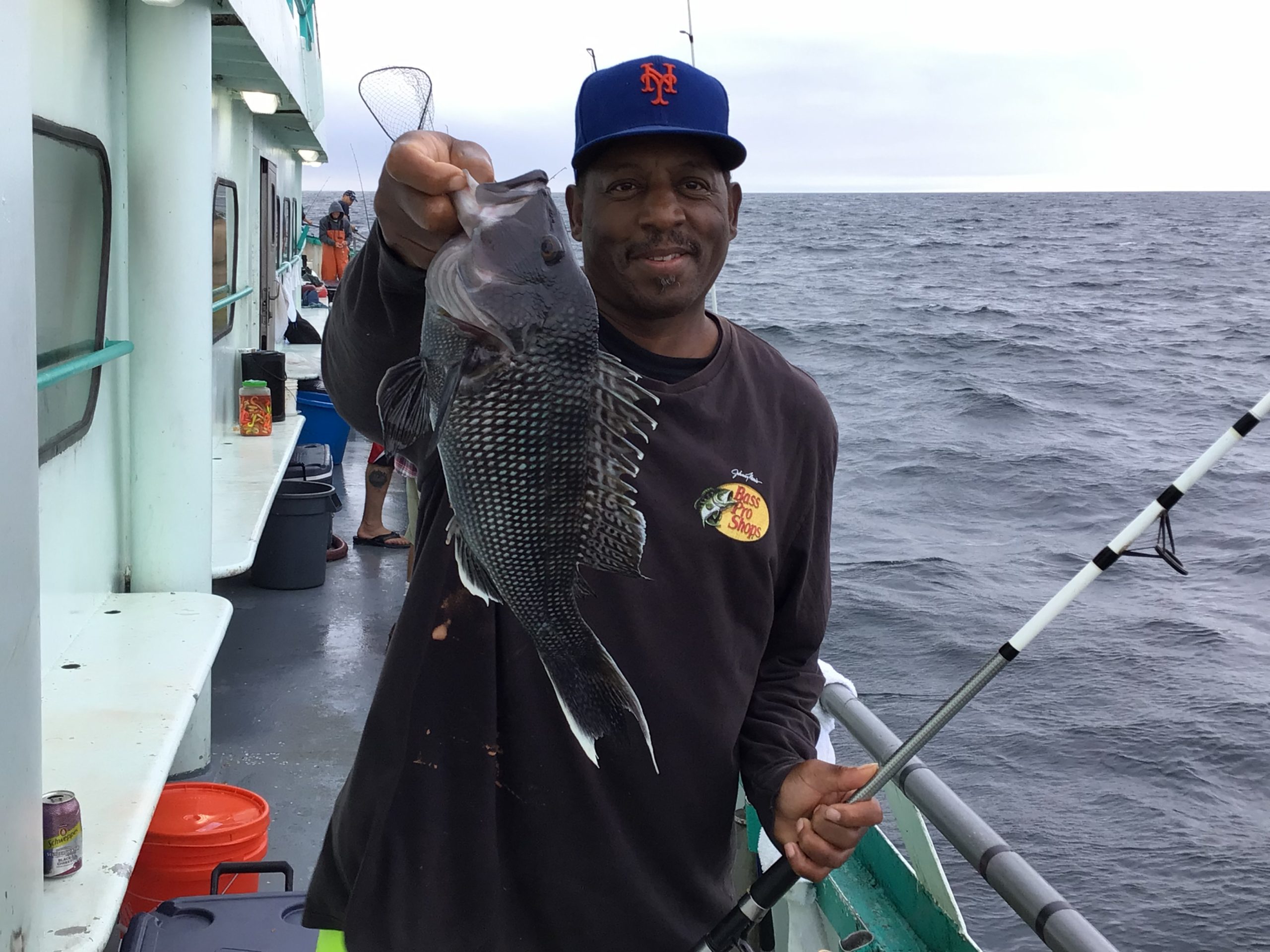a man holding a fish in the water
