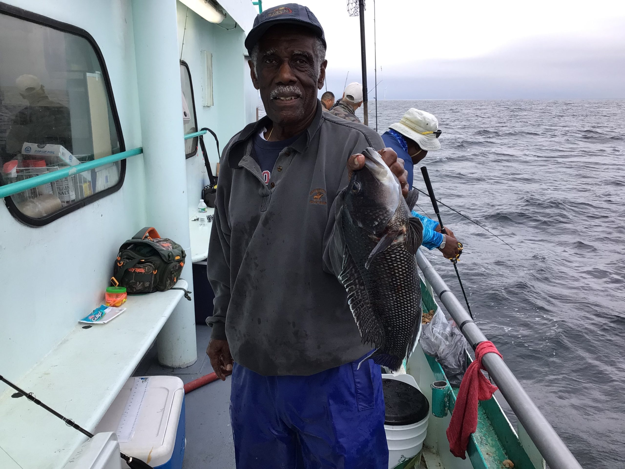 a man holding a fish