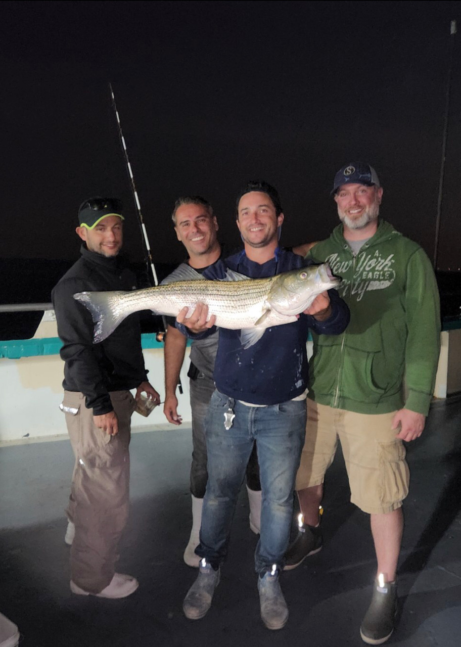 a man holding a fish