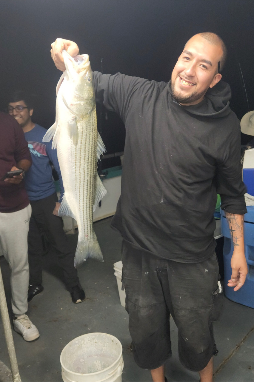a man holding a fish