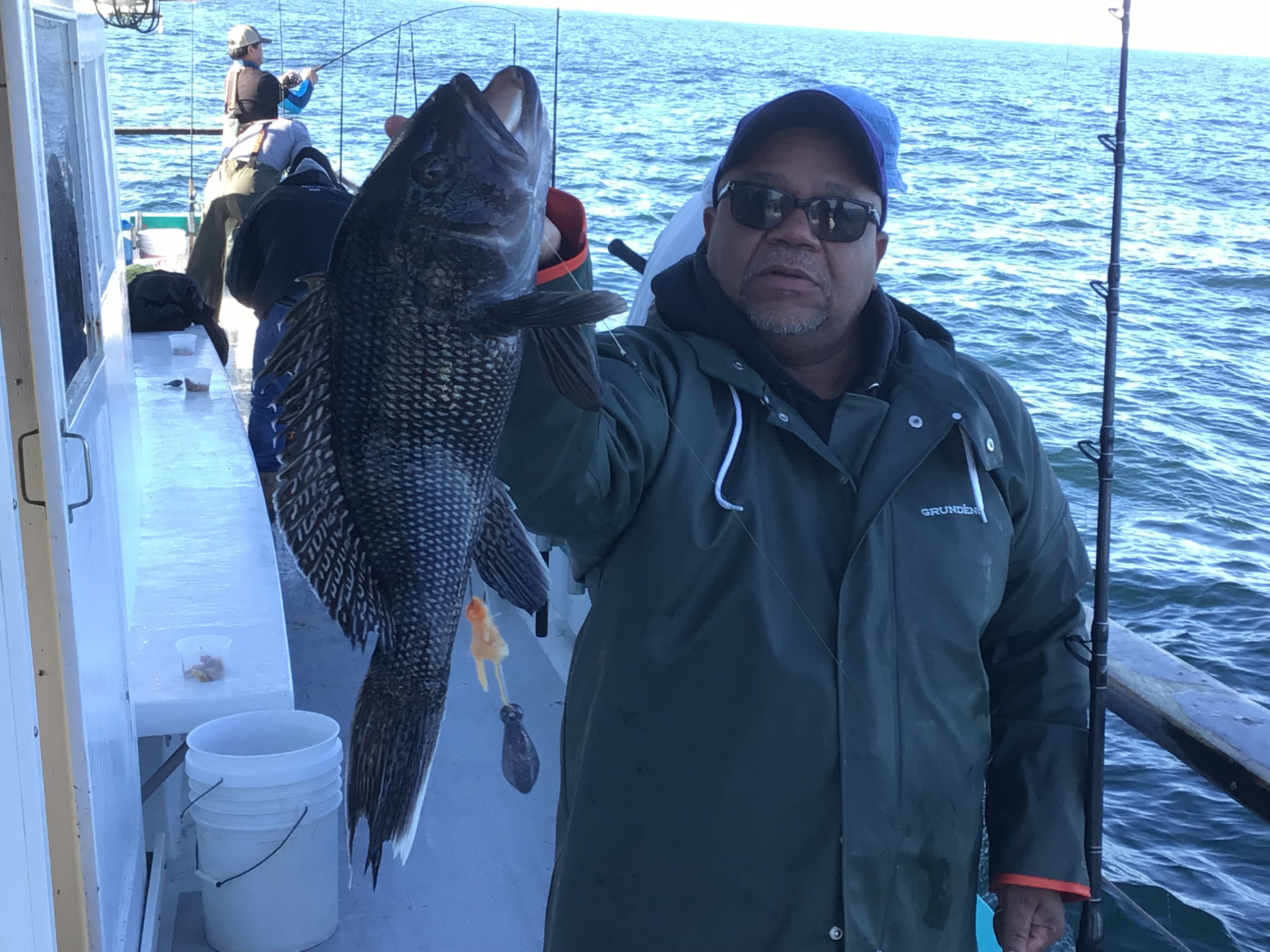 a person holding a fish in the water