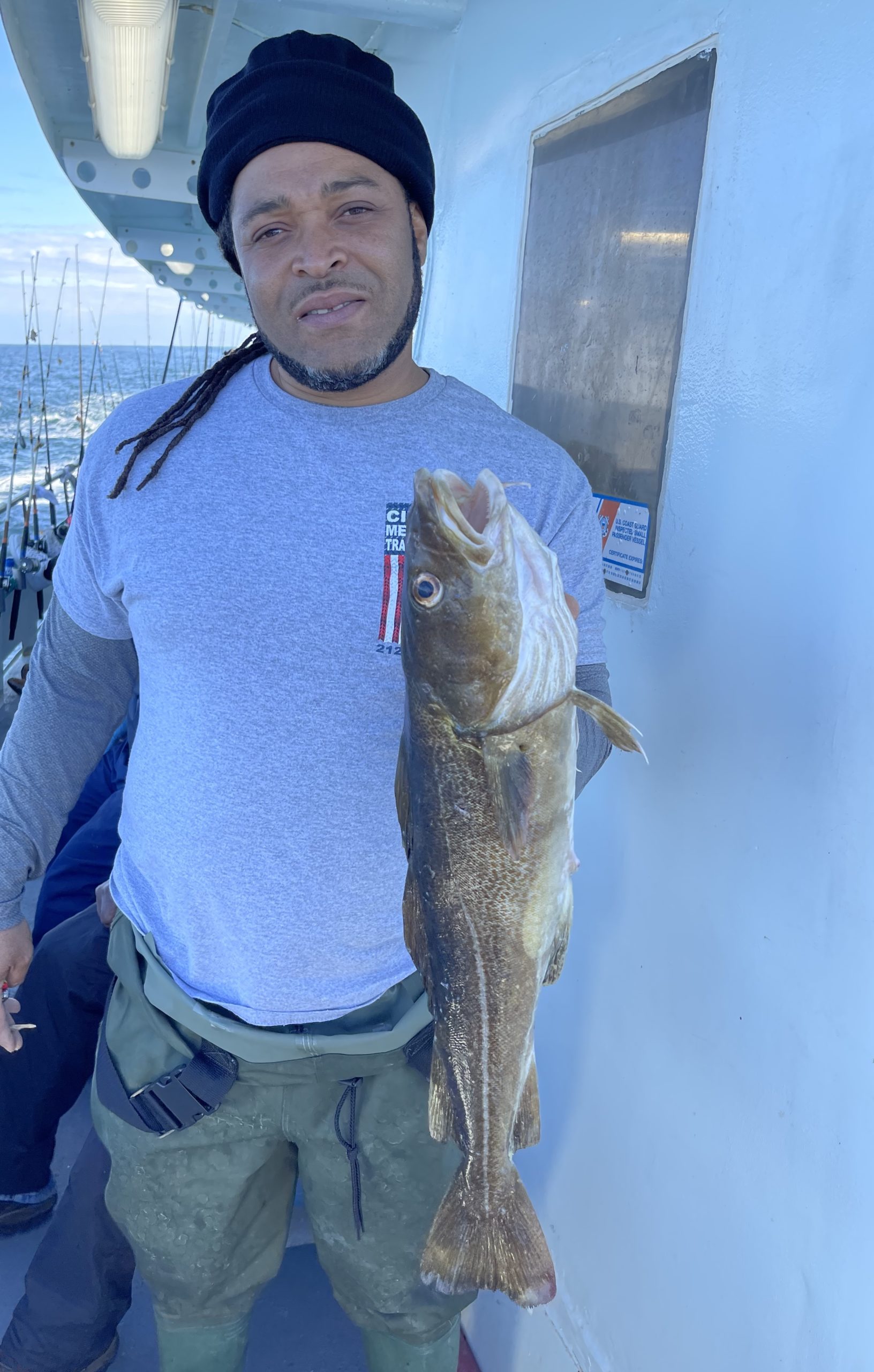 a man holding a fish
