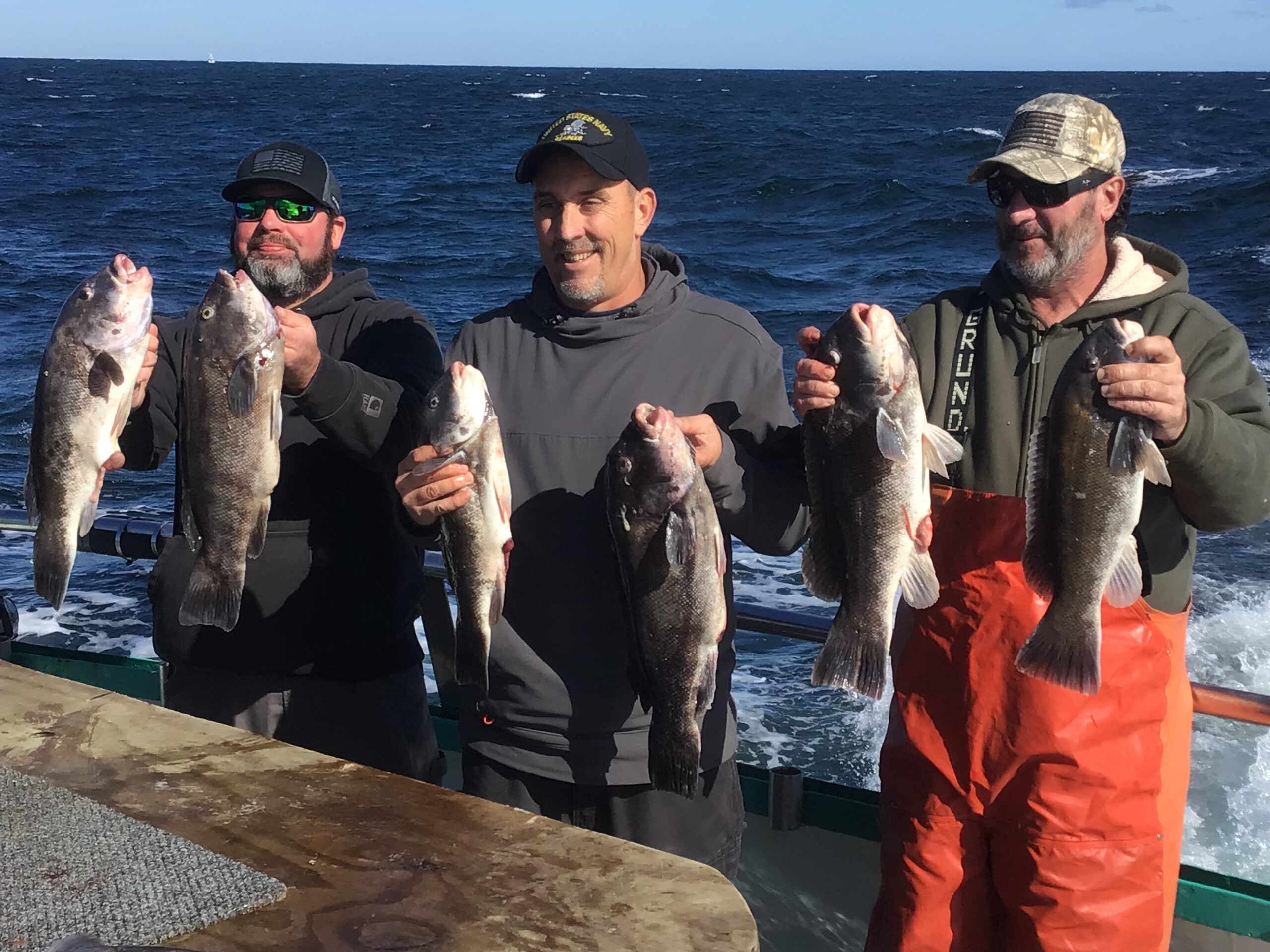 a man holding a fish in the water