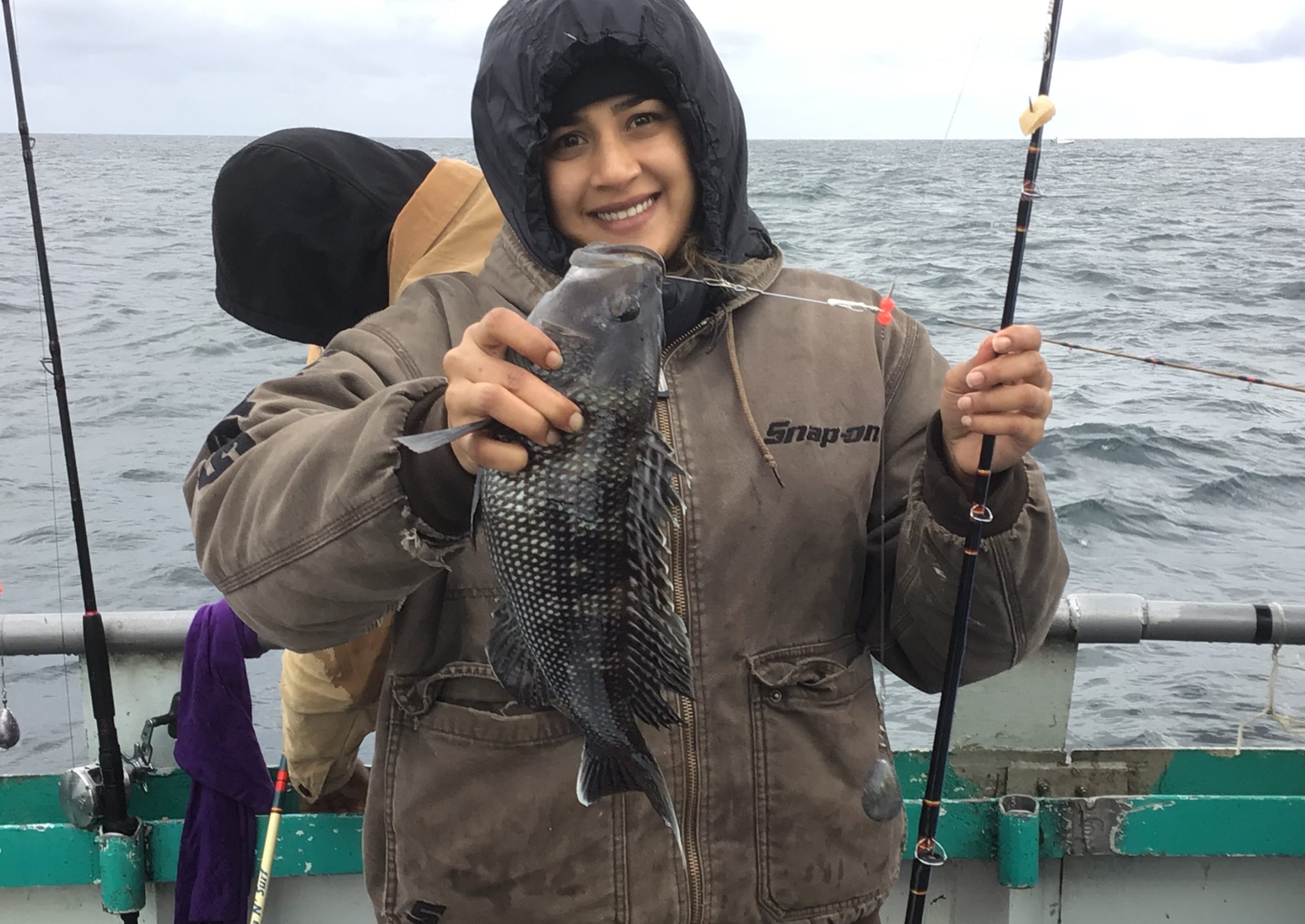 a person standing next to a body of water